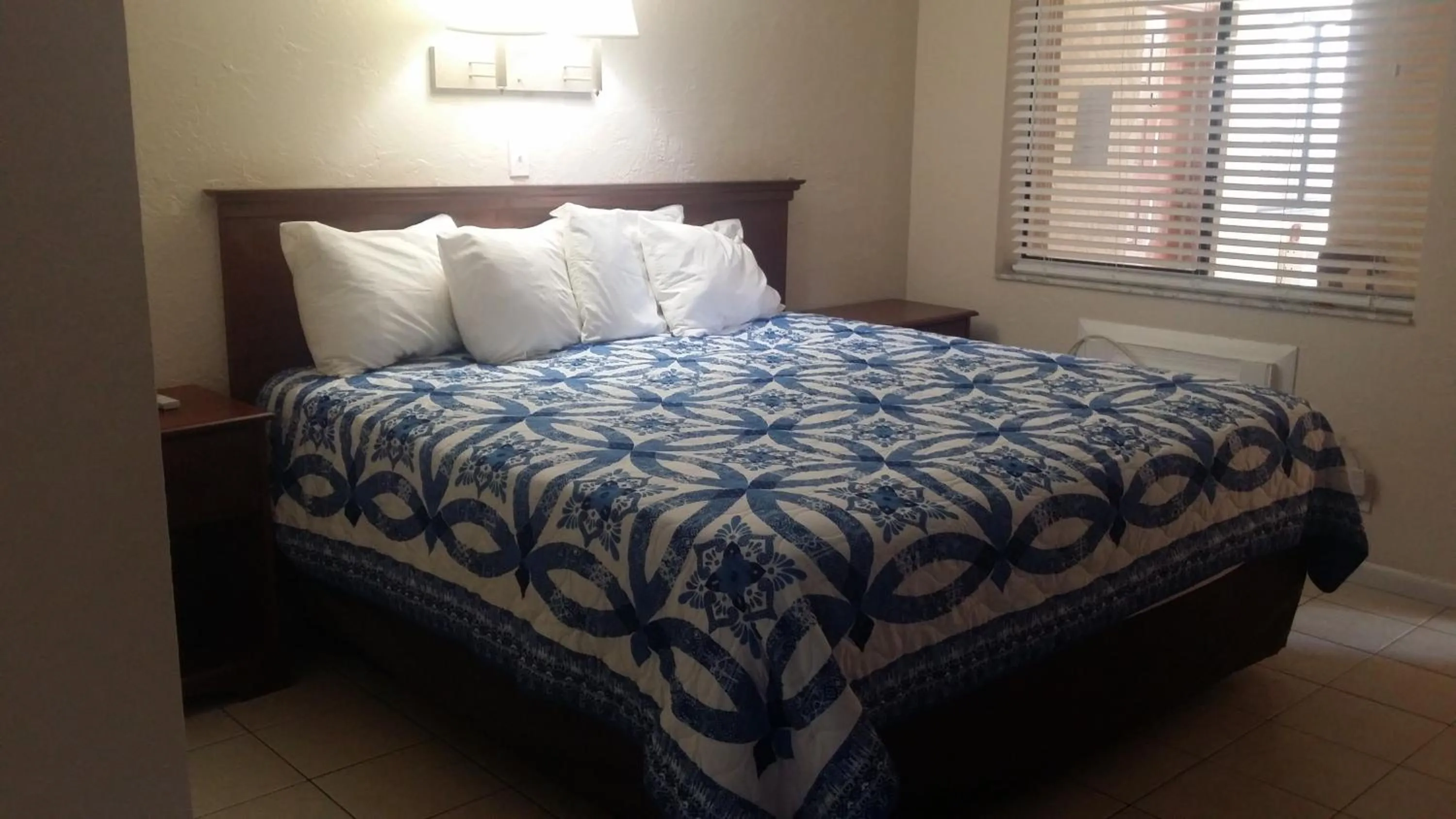 Bed in Palm Breeze Hotel