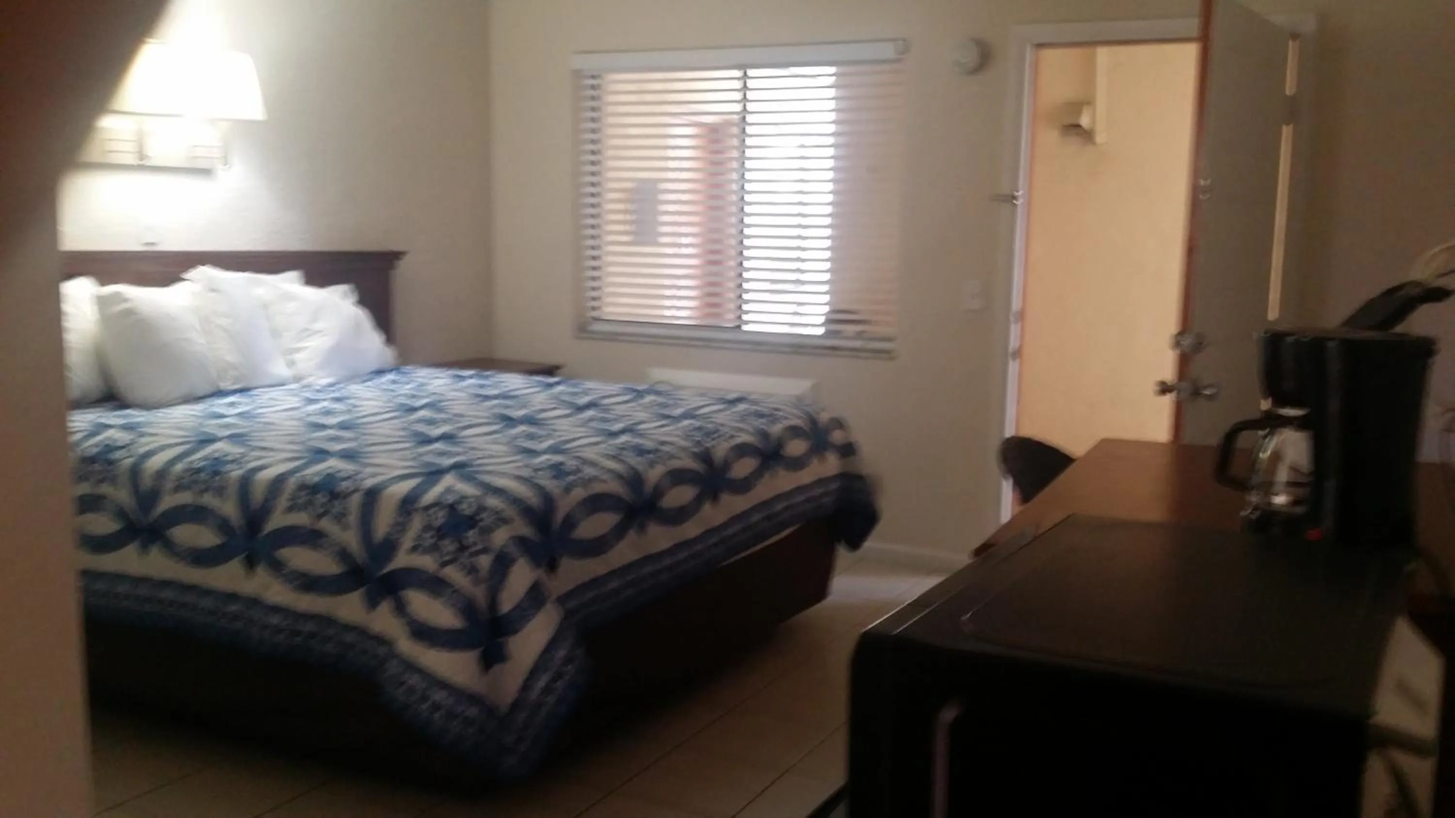 Bed in Palm Breeze Hotel