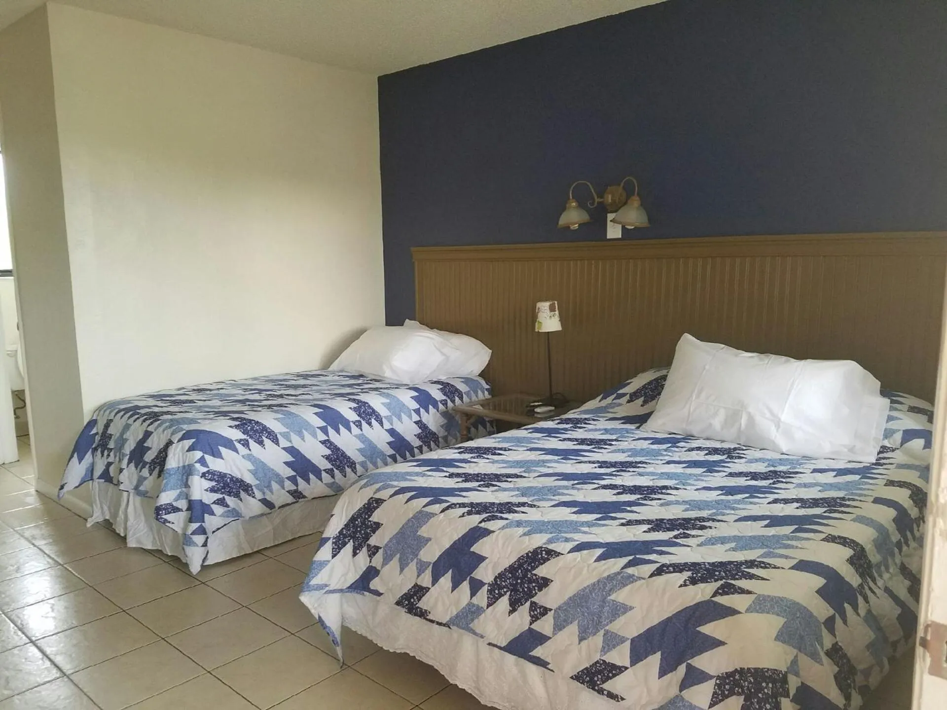 Bed in Palm Breeze Hotel