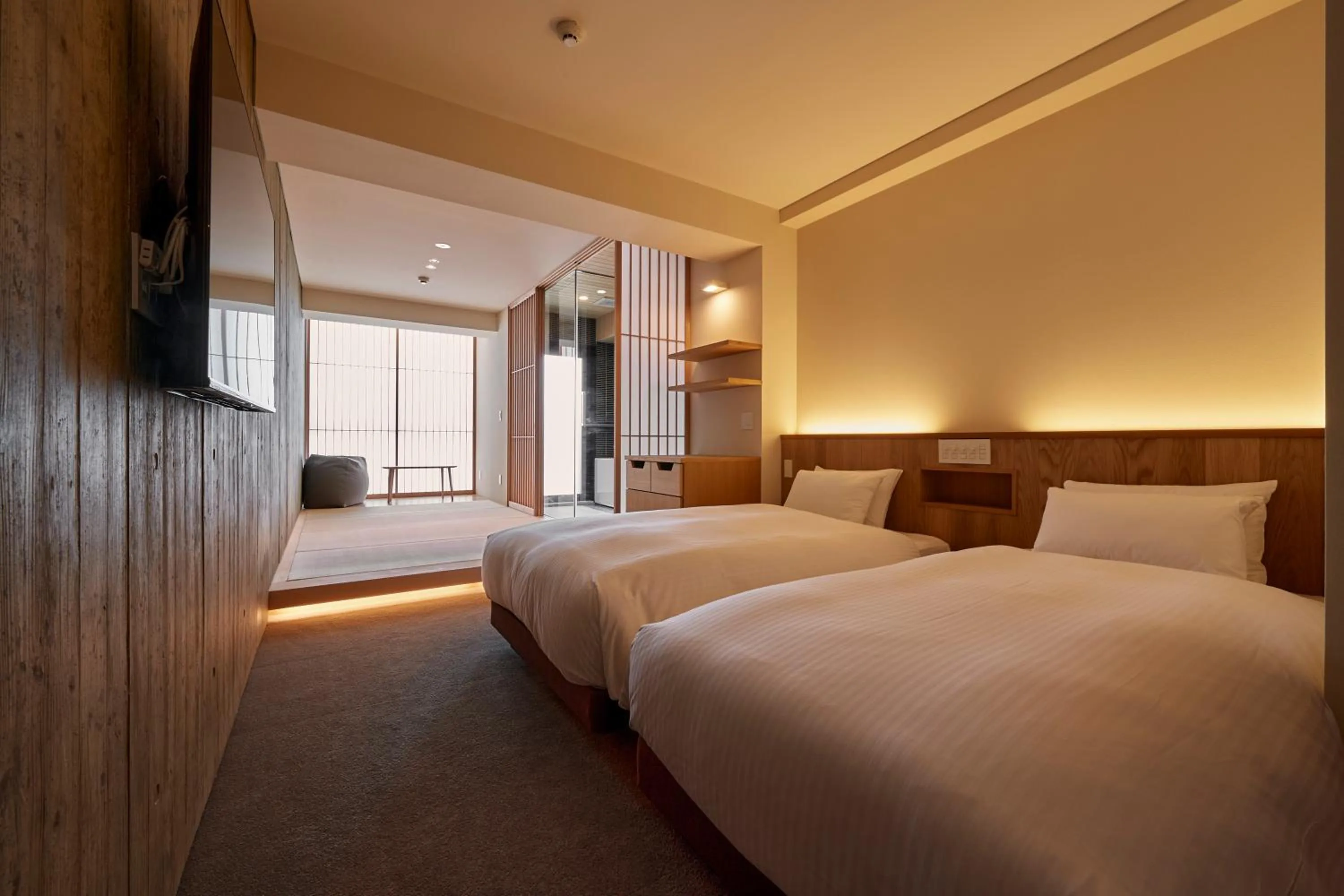 Bed in THE HOTELS HAKATA Harushige Honkan