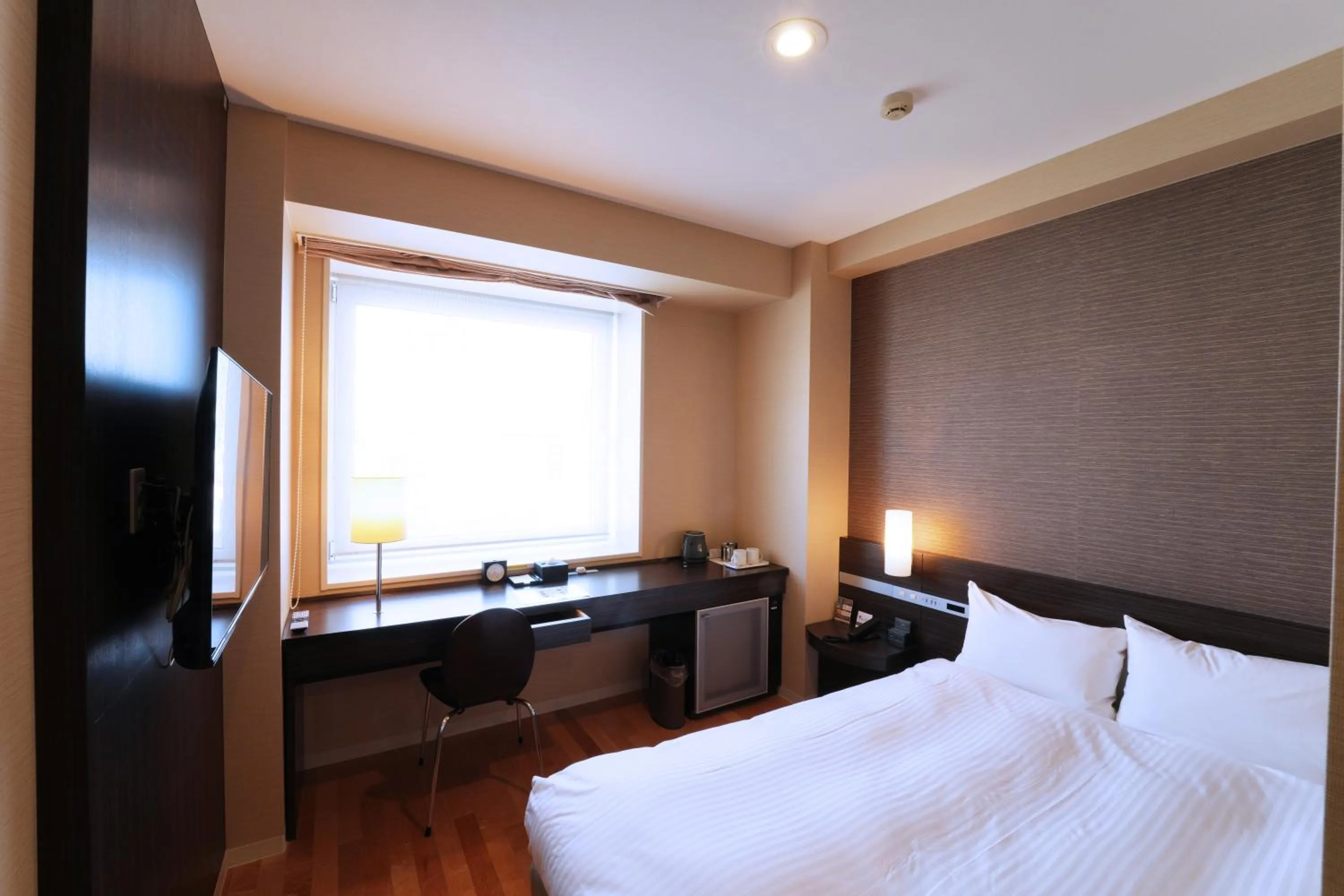 Photo of the whole room, Bed in KOKO HOTEL Sendai Kotodai Park
