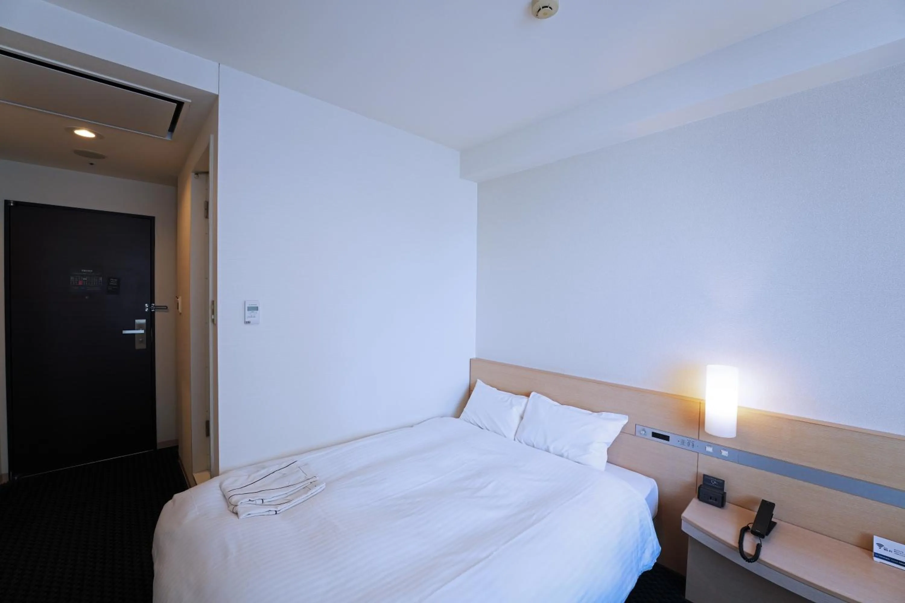 Photo of the whole room, Bed in KOKO HOTEL Sendai Kotodai Park
