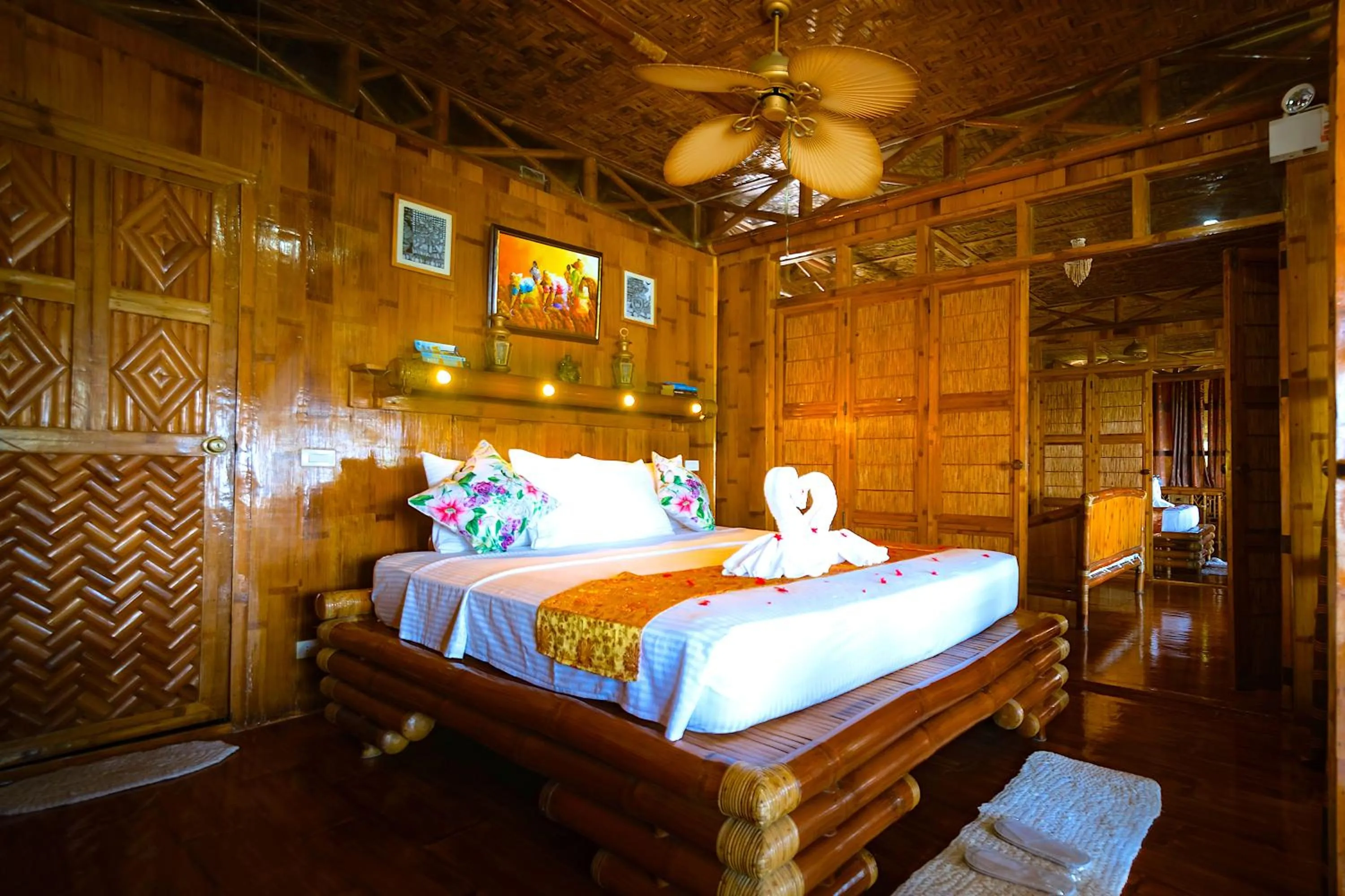 Bed in The Coral Blue Oriental Beach Villas and Suites