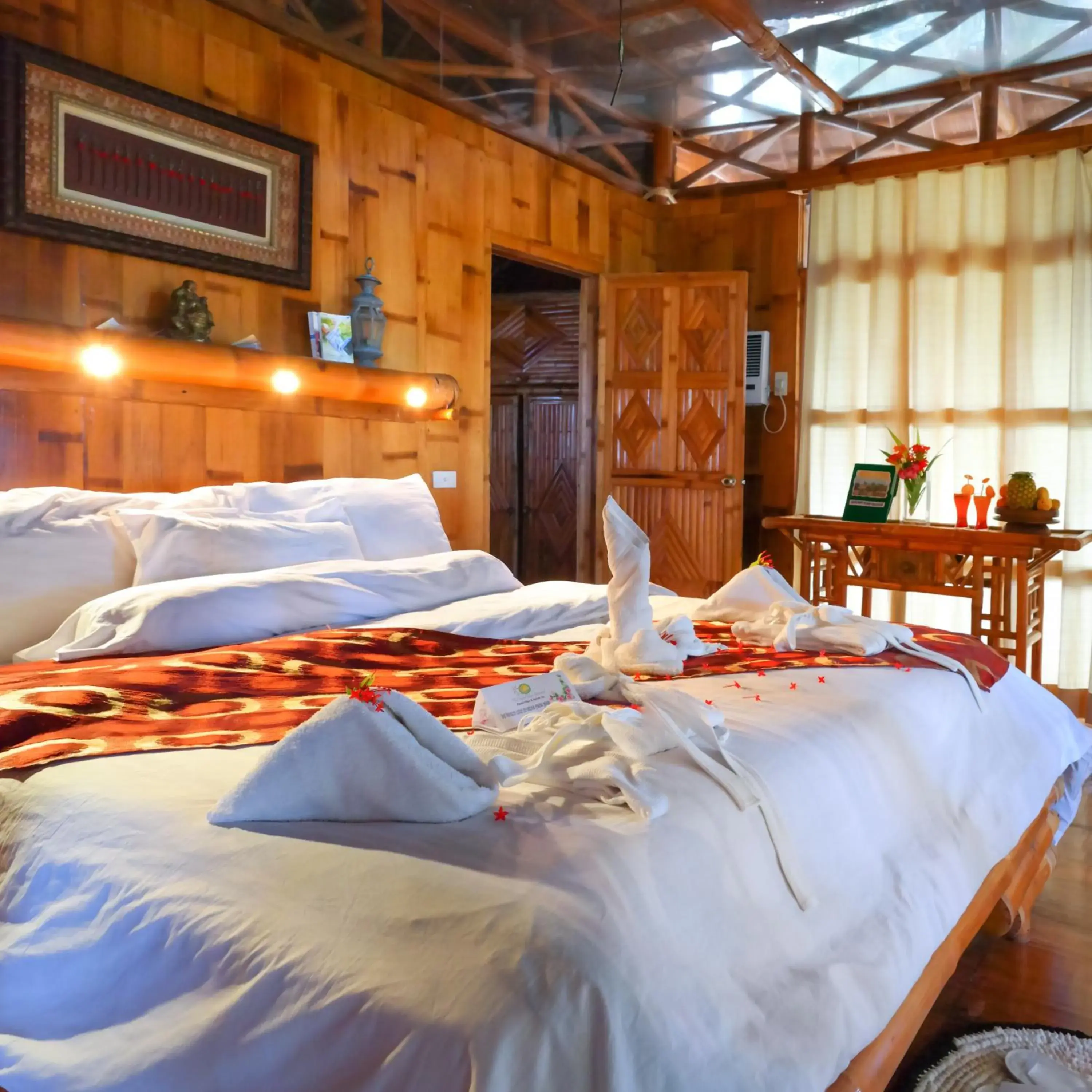 Bed in The Coral Blue Oriental Beach Villas and Suites Bed in The Coral Blue Oriental Beach Villas and Suites