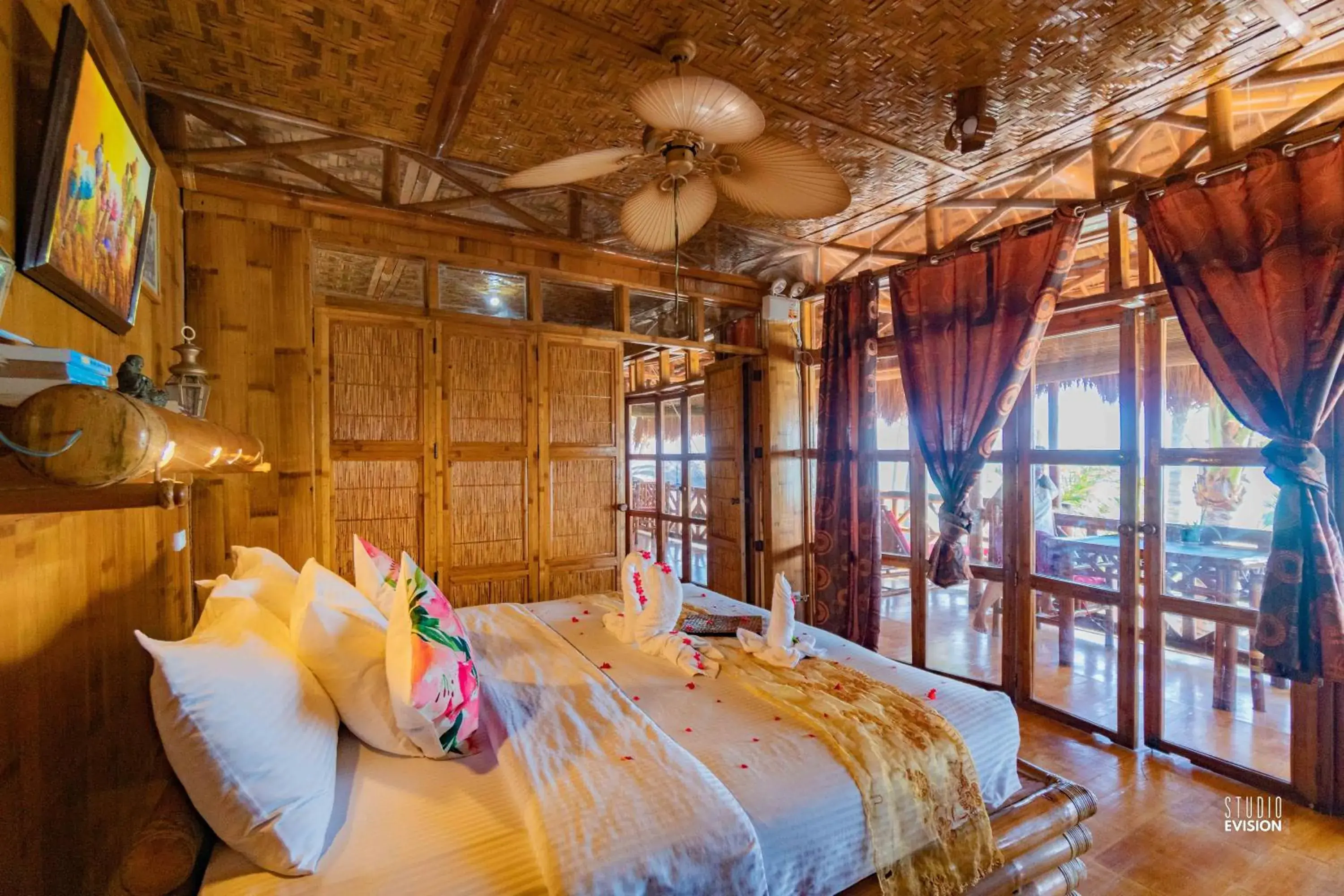 Bed in The Coral Blue Oriental Beach Villas and Suites Bed in The Coral Blue Oriental Beach Villas and Suites