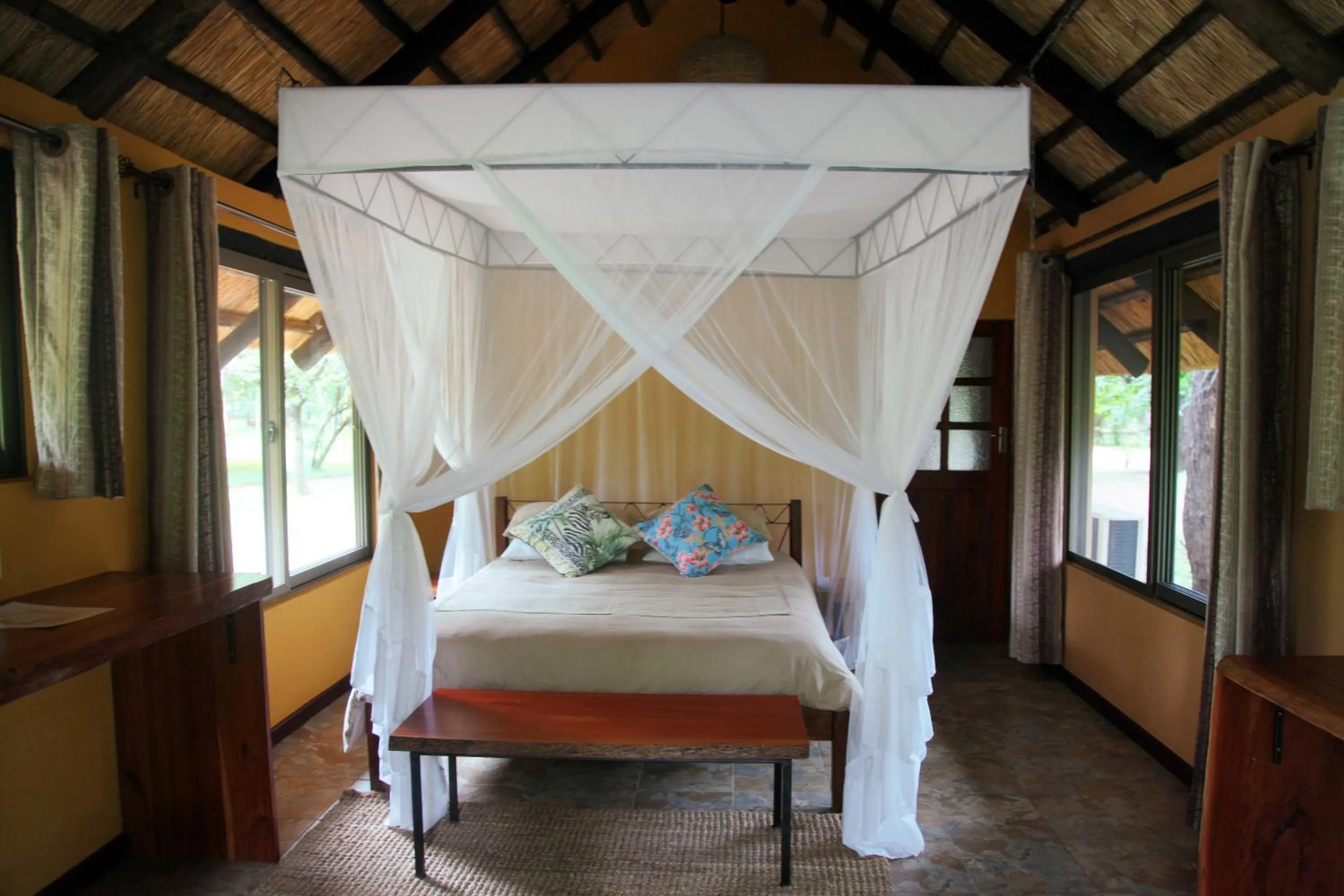 Bed in Maramba River Lodge