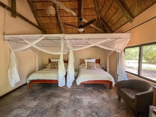 Bed in Maramba River Lodge