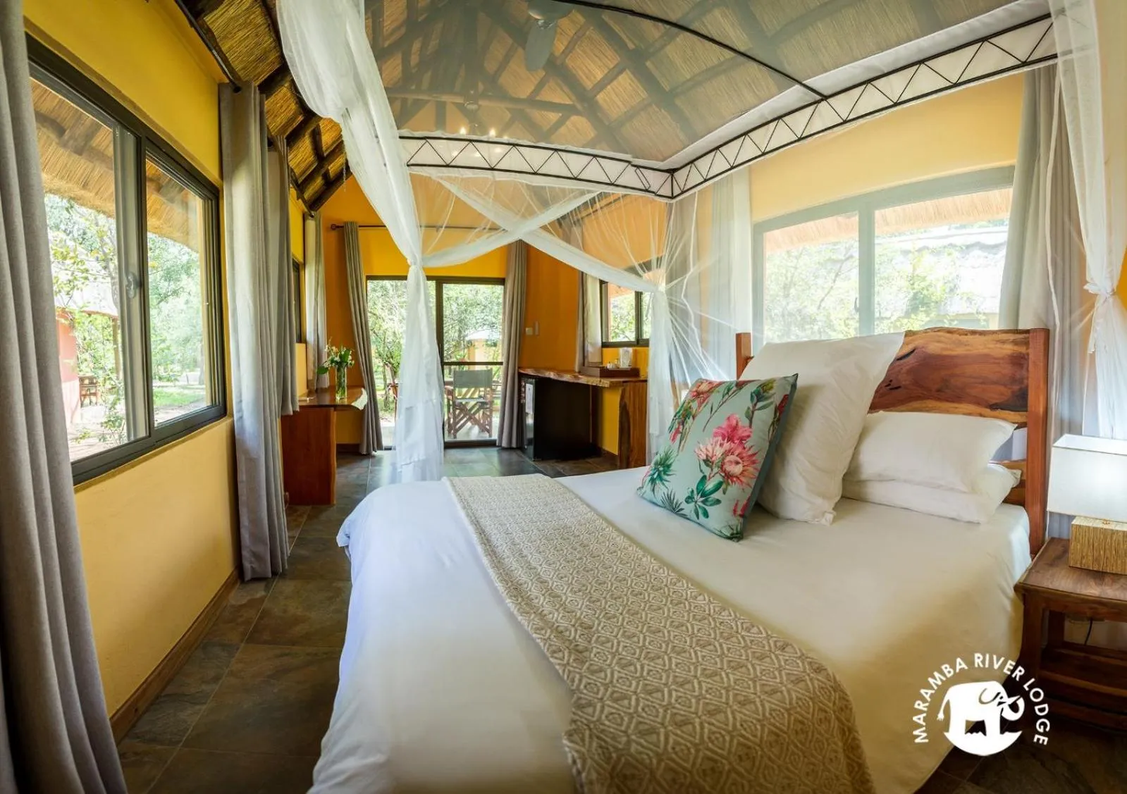 Bed in Maramba River Lodge