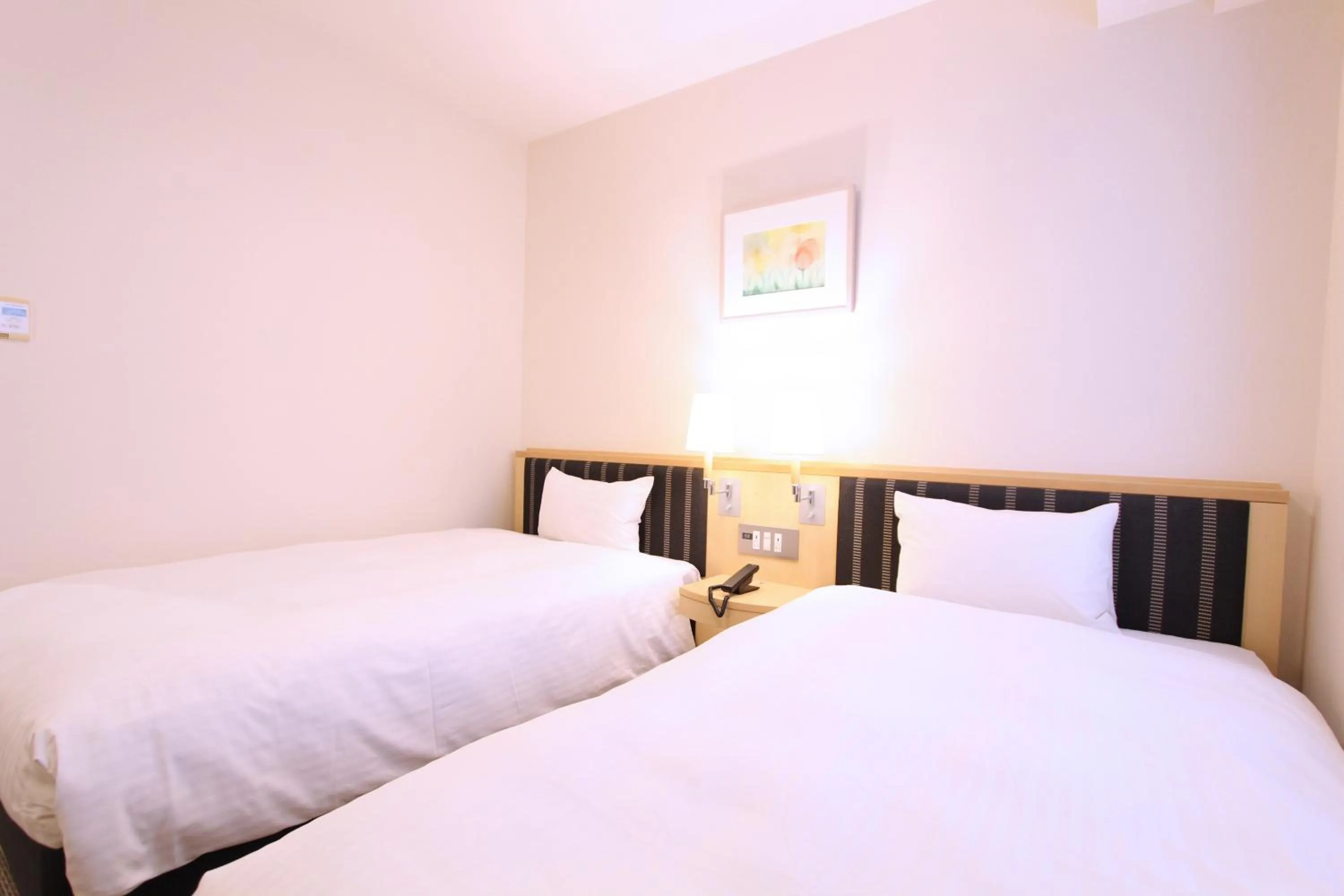 Photo of the whole room, Bed in KOKO HOTEL Sendai Station West