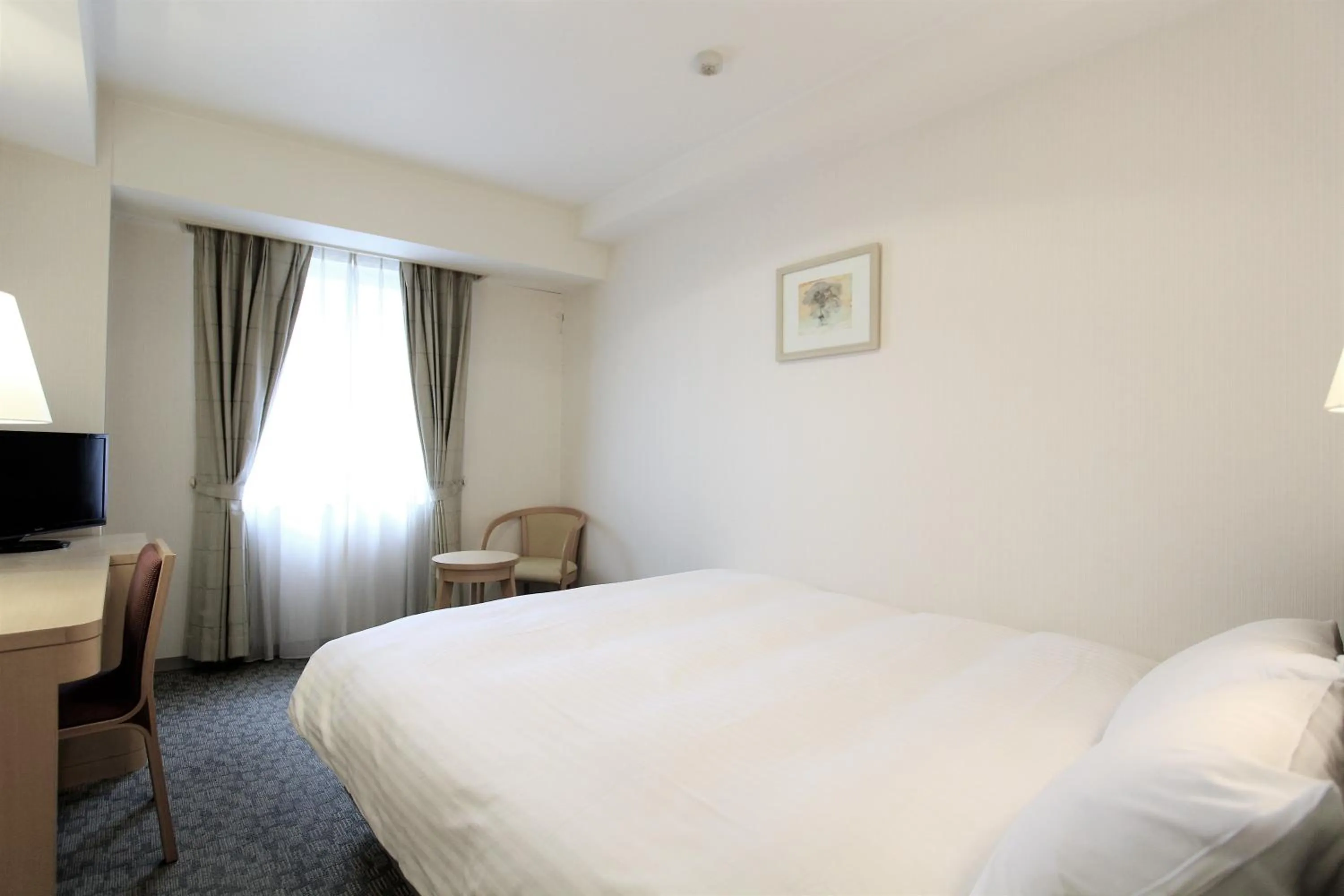 Photo of the whole room, Bed in KOKO HOTEL Sendai Station South