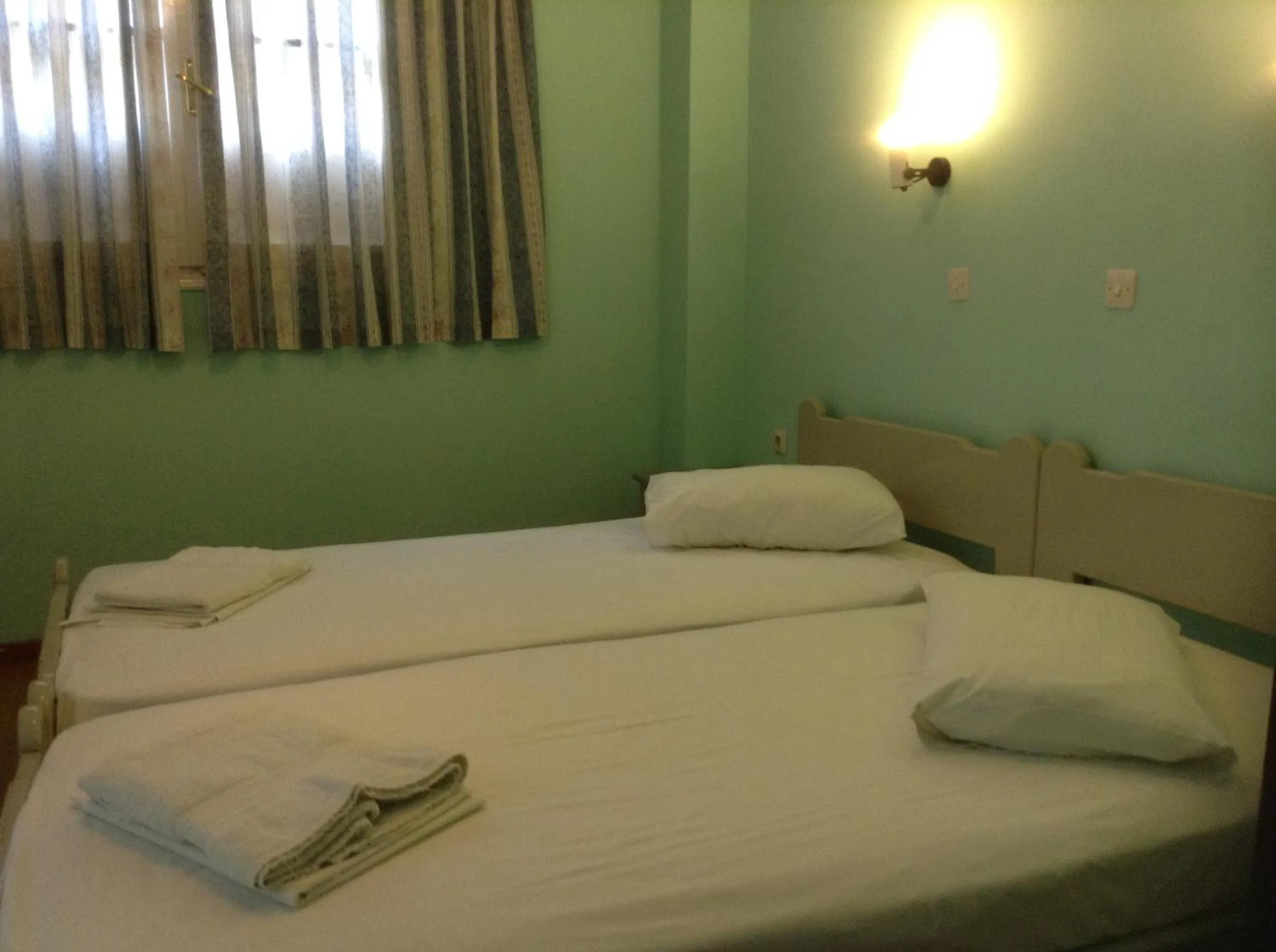 Bed in Haritos Hotel - Geothermal Hot Swimming Pool