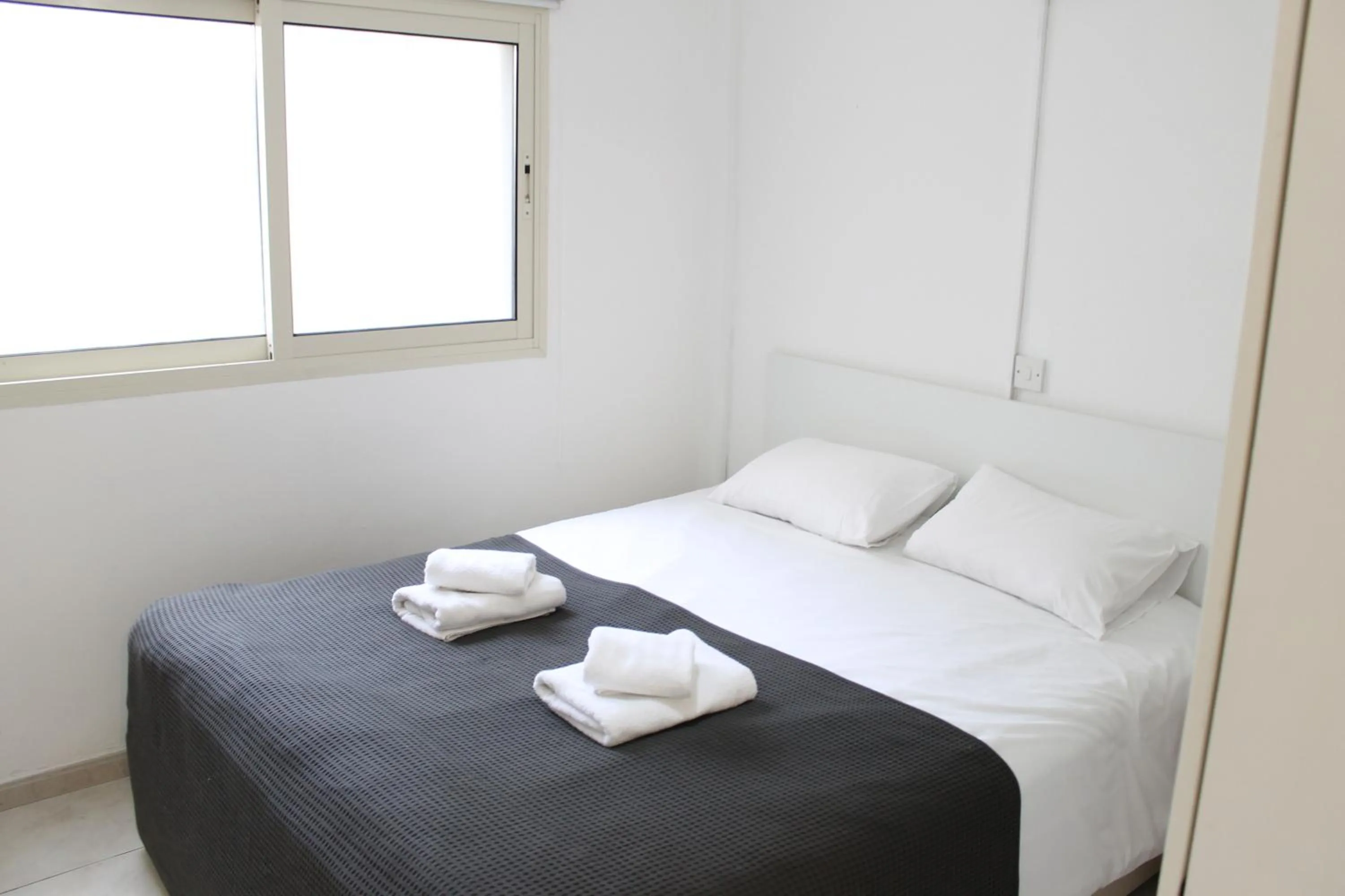 Bed in Stephanie City Apartments