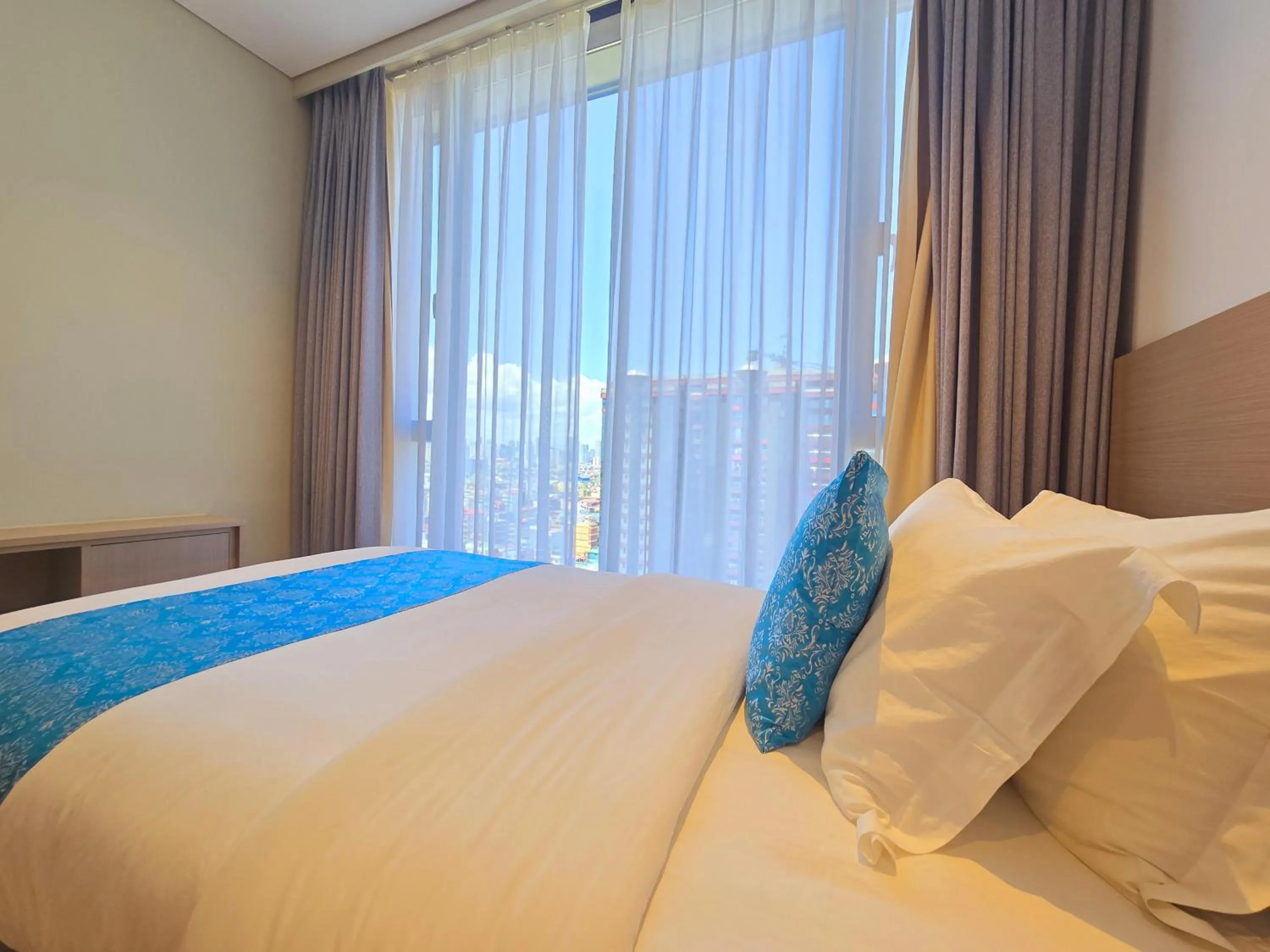 Bed in Bayprime Hotel