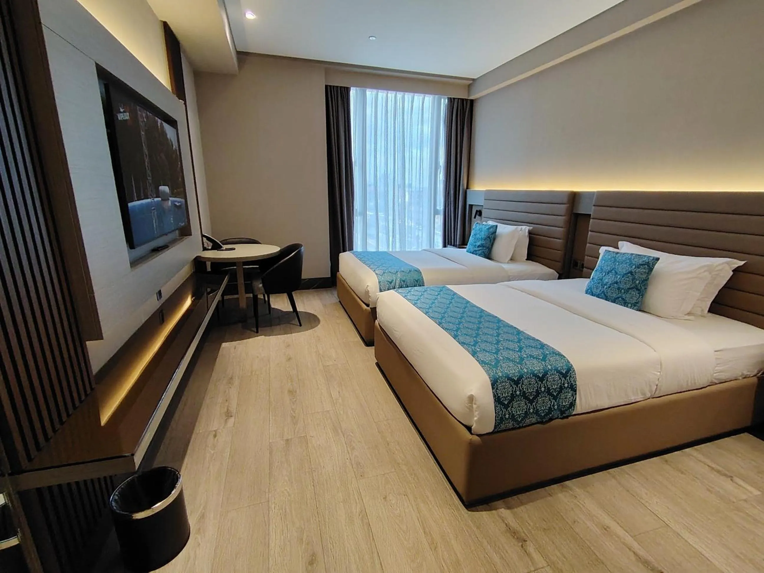 Bed in Bayprime Hotel