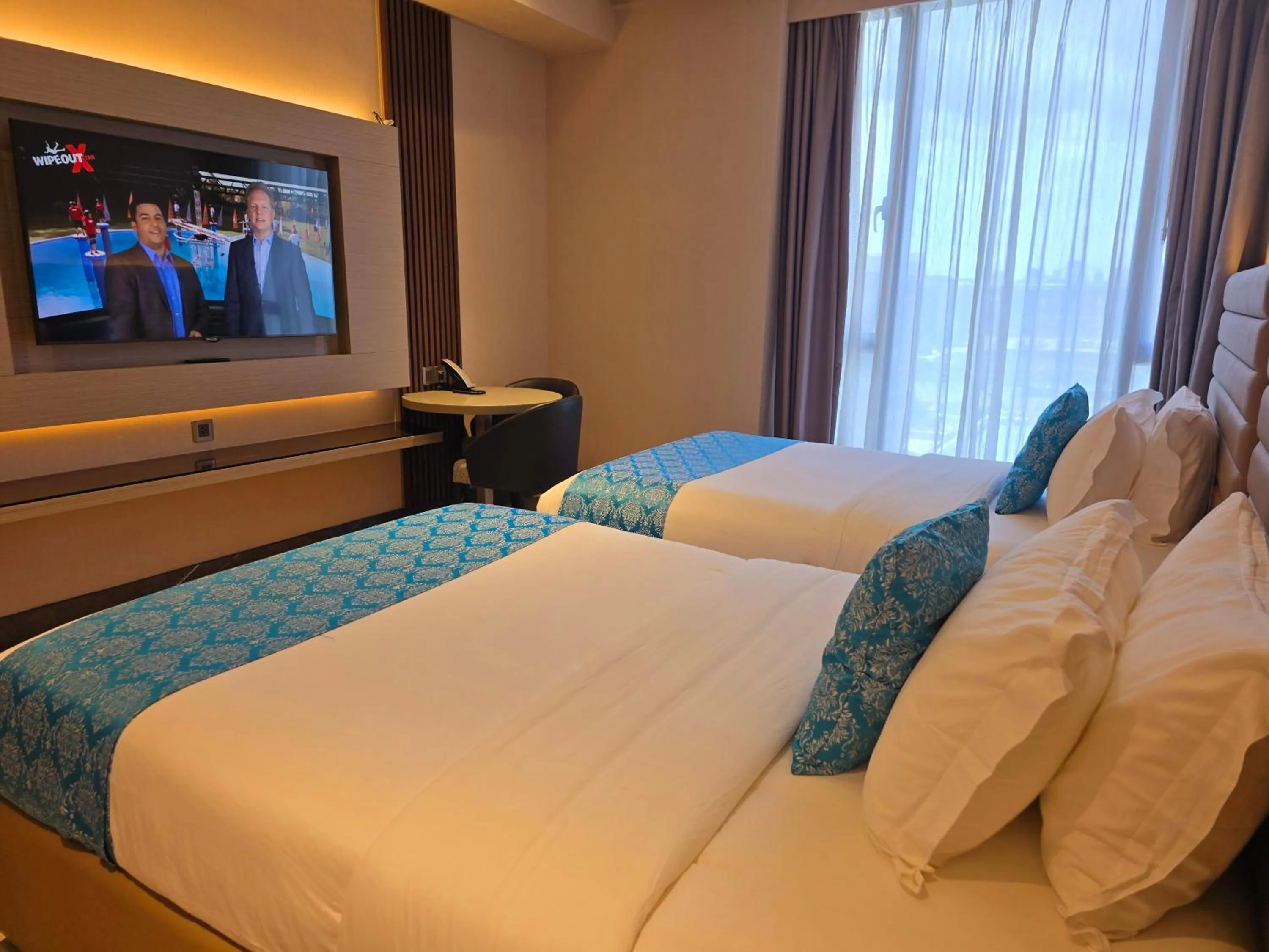 Bed in Bayprime Hotel