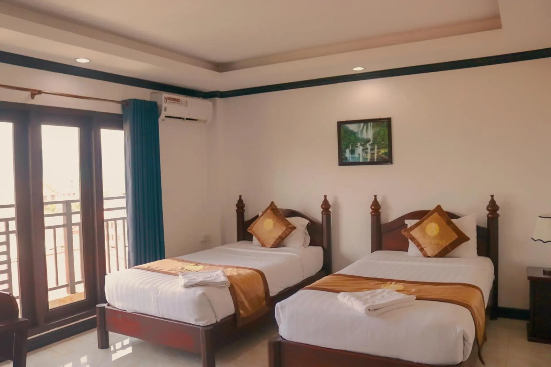 Bed in Vang Vieng Consiana Hotel