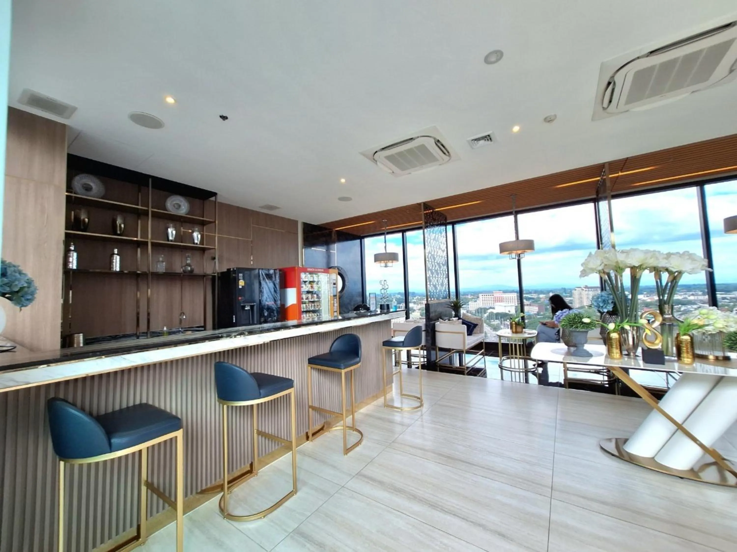 Communal lounge/ TV room in Astra Sky River Chiang Mai by Fang