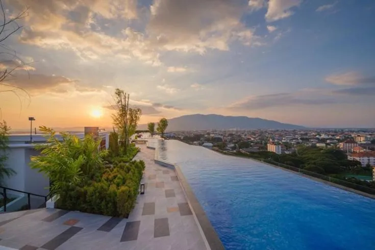 Swimming pool in Astra Sky River Chiang Mai by Fang