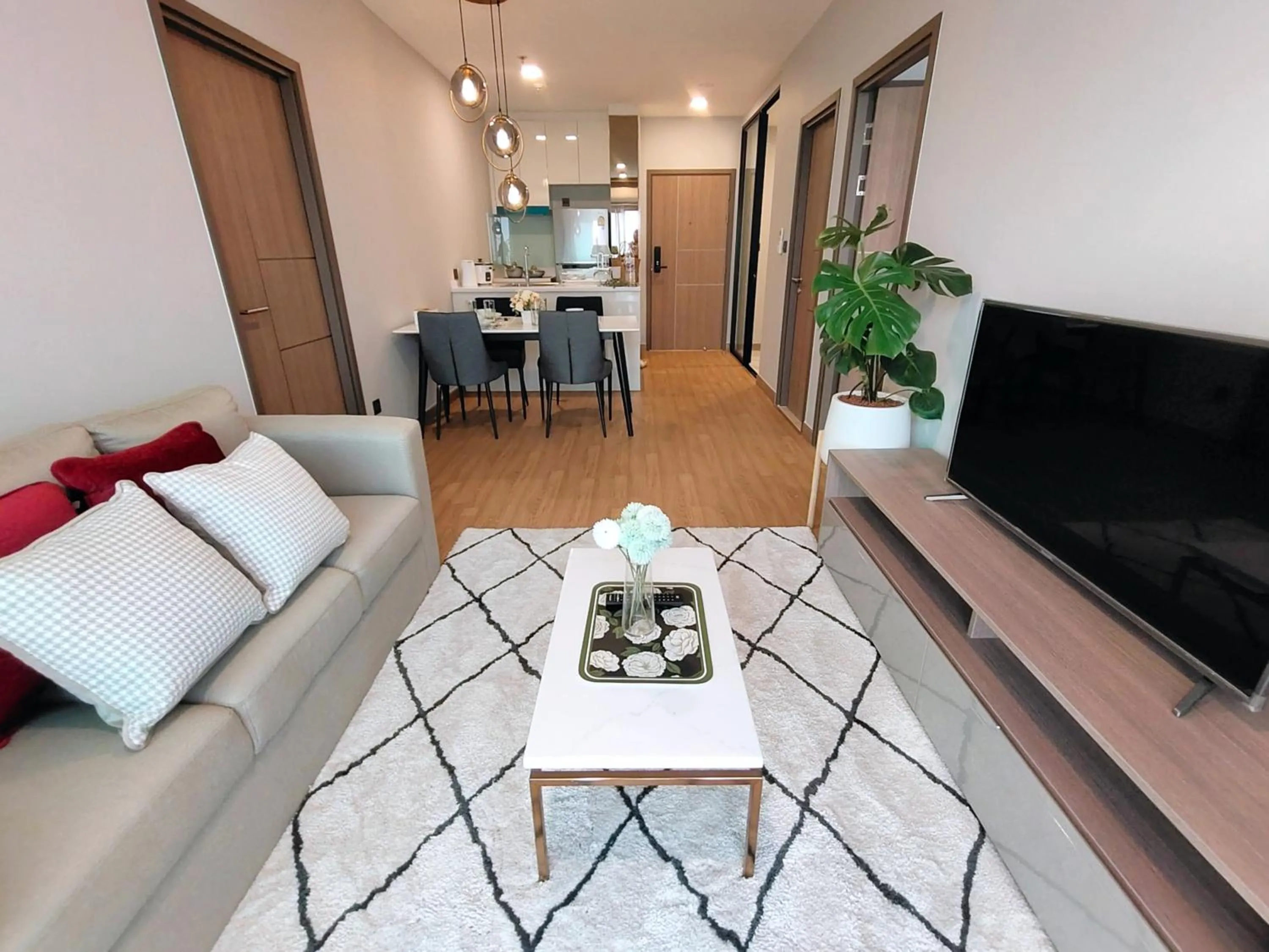 Communal lounge/ TV room in Astra Sky River Chiang Mai by Fang