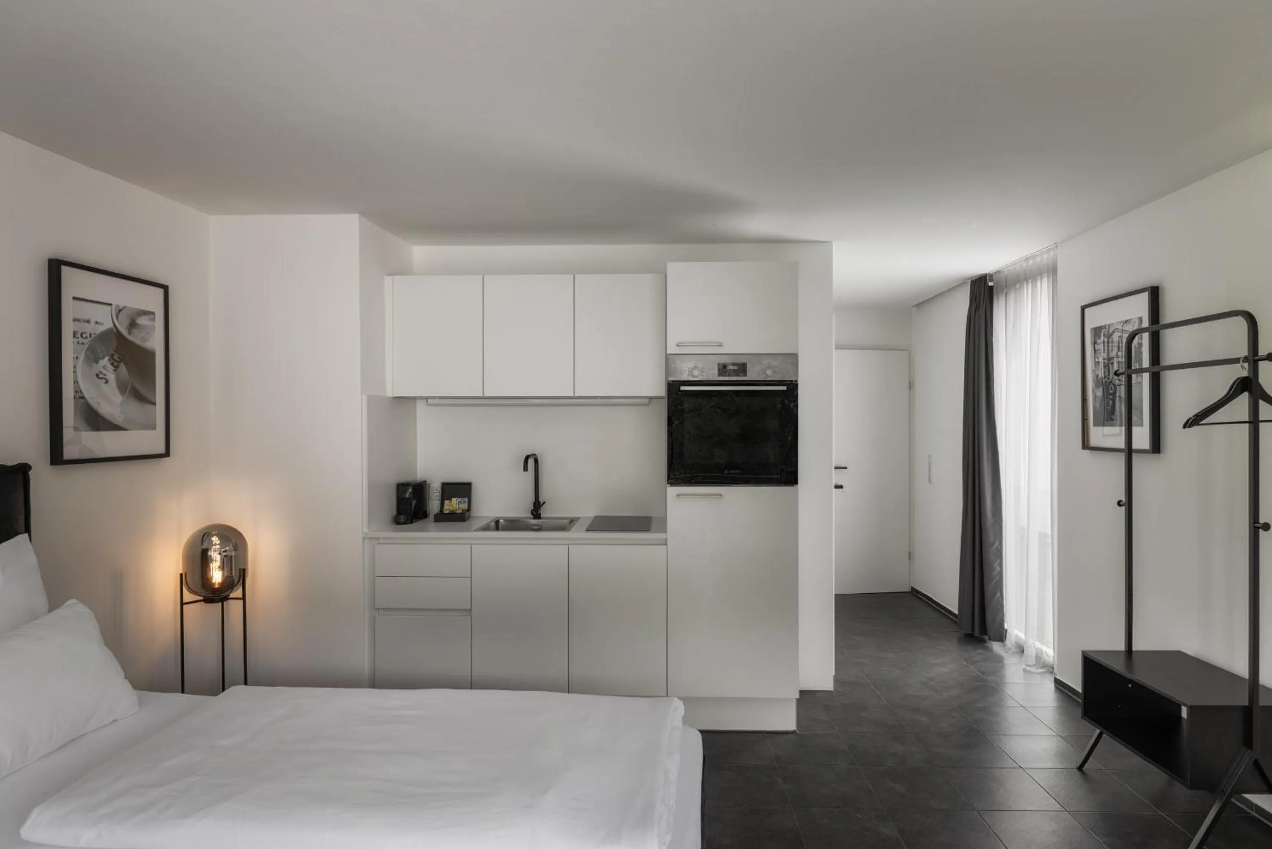 kitchen, Bed in Motel by Maier Feldkirch - kontaktloser Check-in