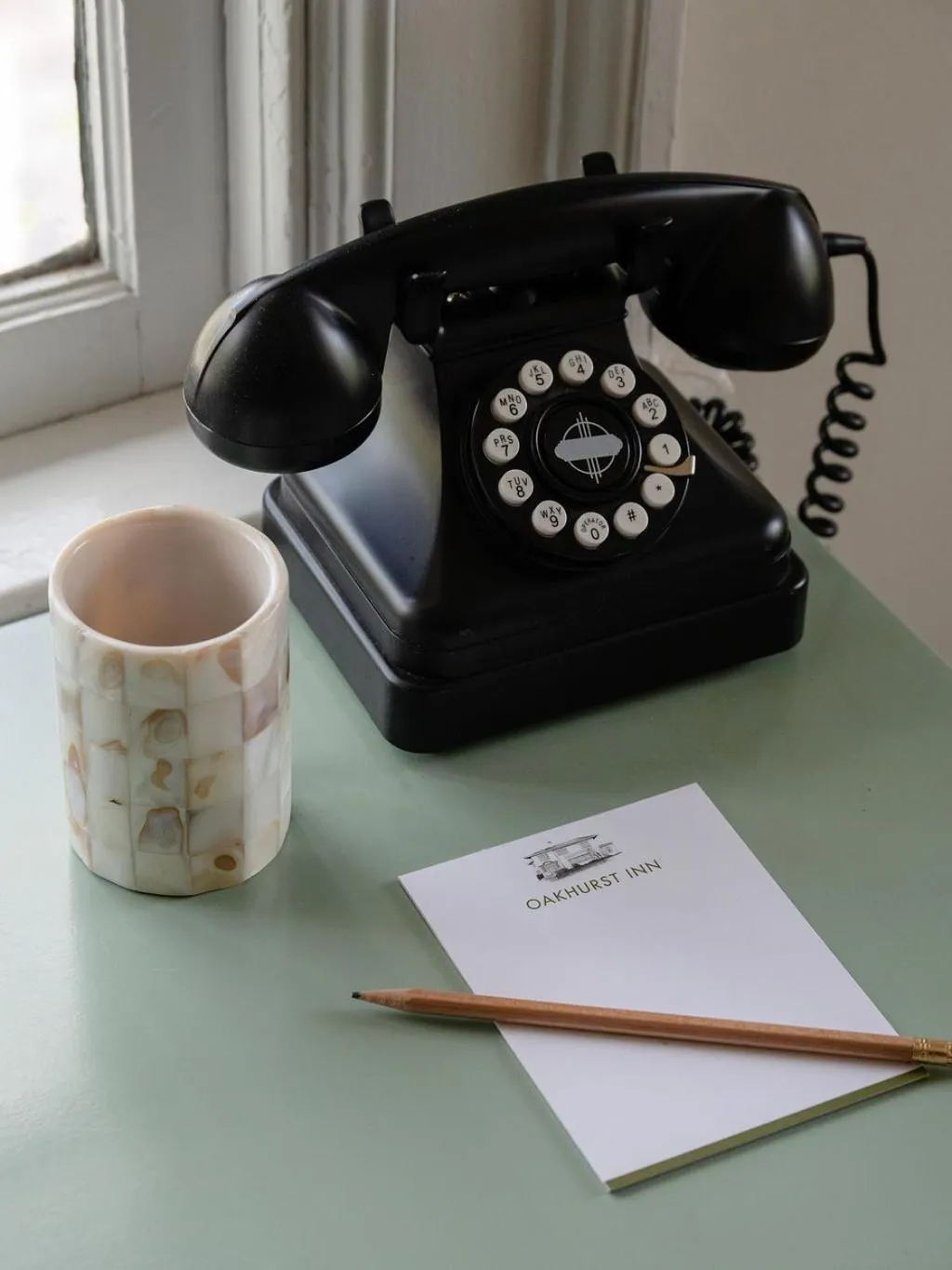 Property logo or sign in Oakhurst Inn at the University