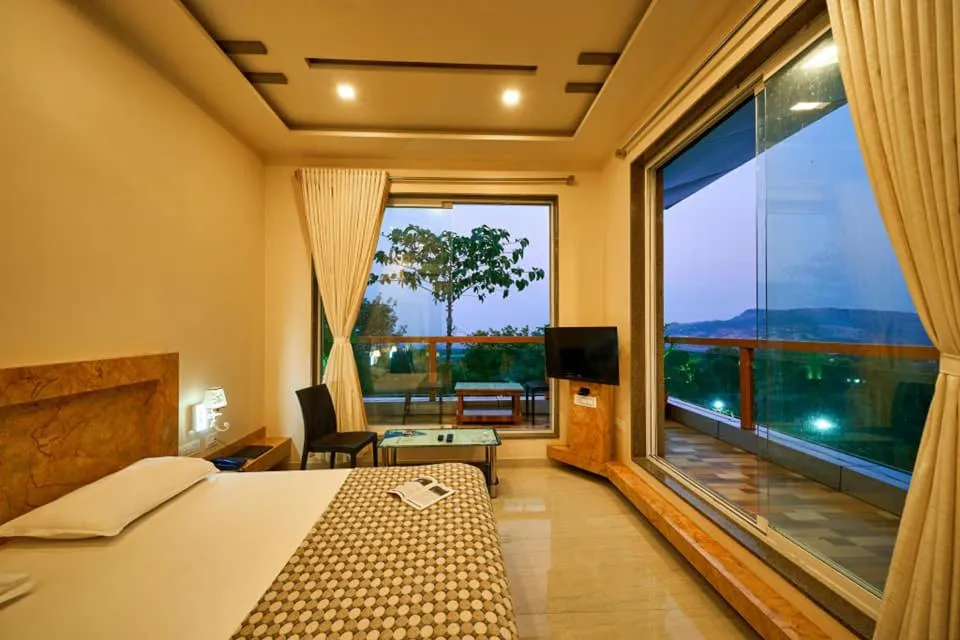 Bed in hotel saptarang residency panhala