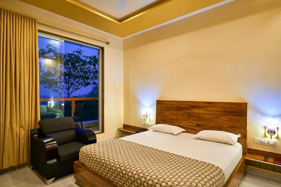 Bed in hotel saptarang residency panhala