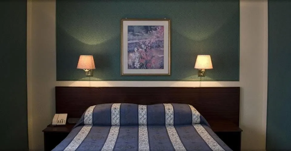 Bed in The Falcon Hotel