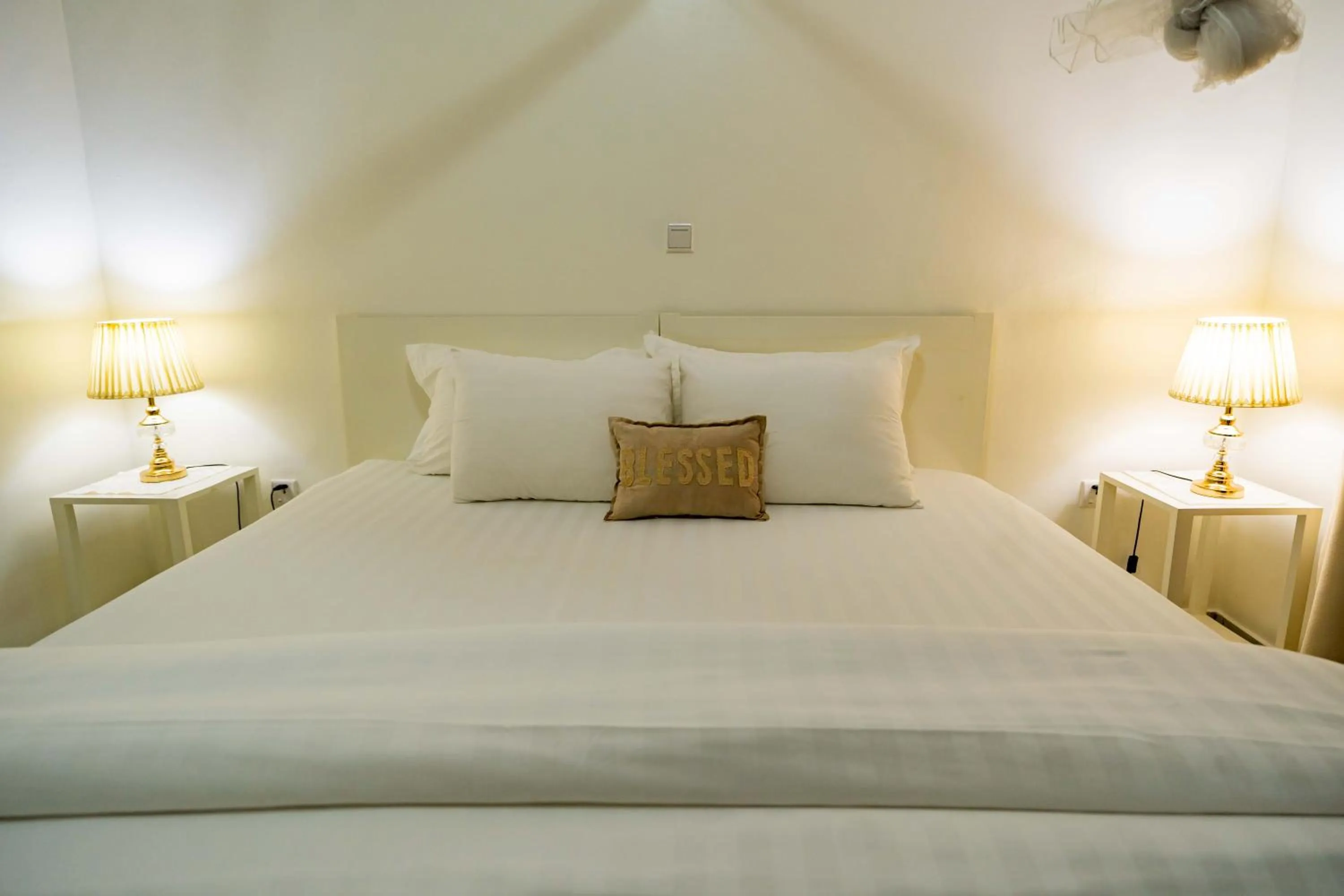 Bed in Blue Veil Villa Hotel