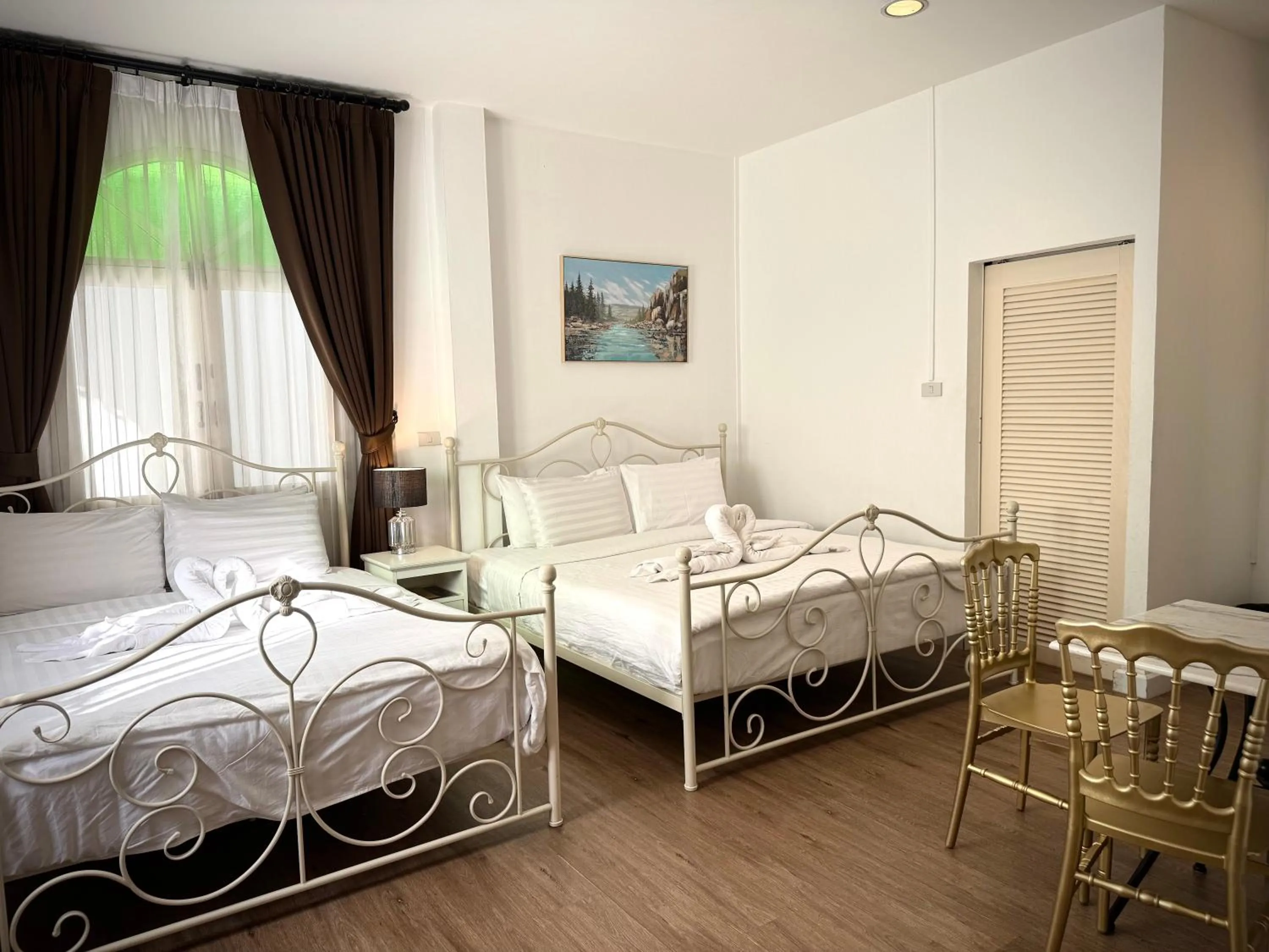 Bed in Nidhra Lanna Hotel Chiang Mai