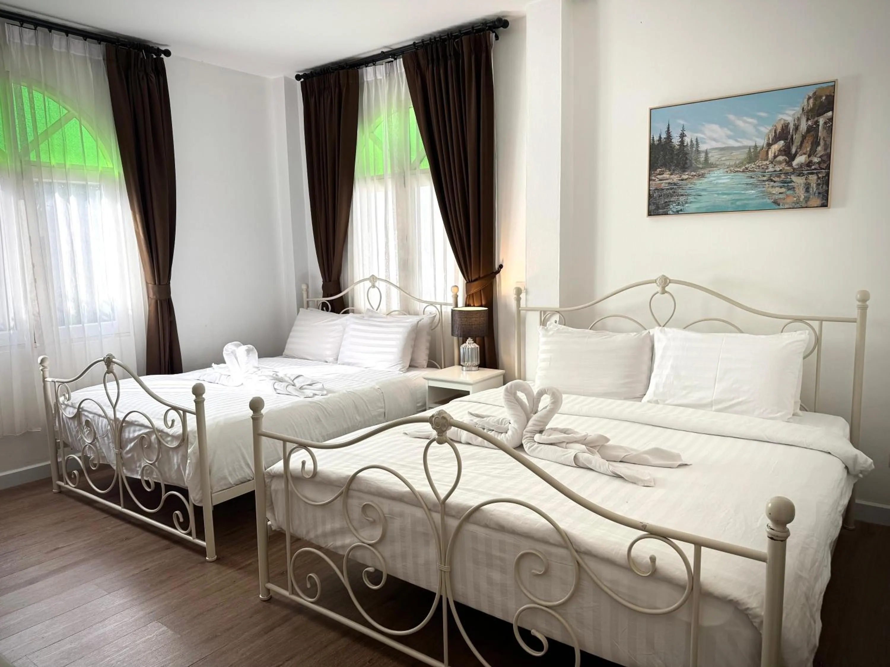 Bed in Nidhra Lanna Hotel Chiang Mai