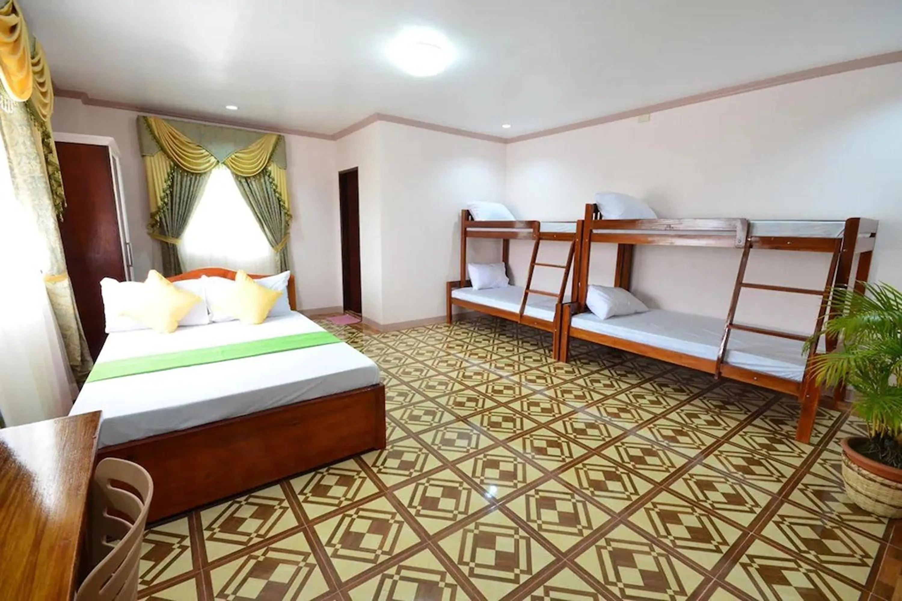 Photo of the whole room, Bed in Gilin Suites Puerto Princesa Palawan
