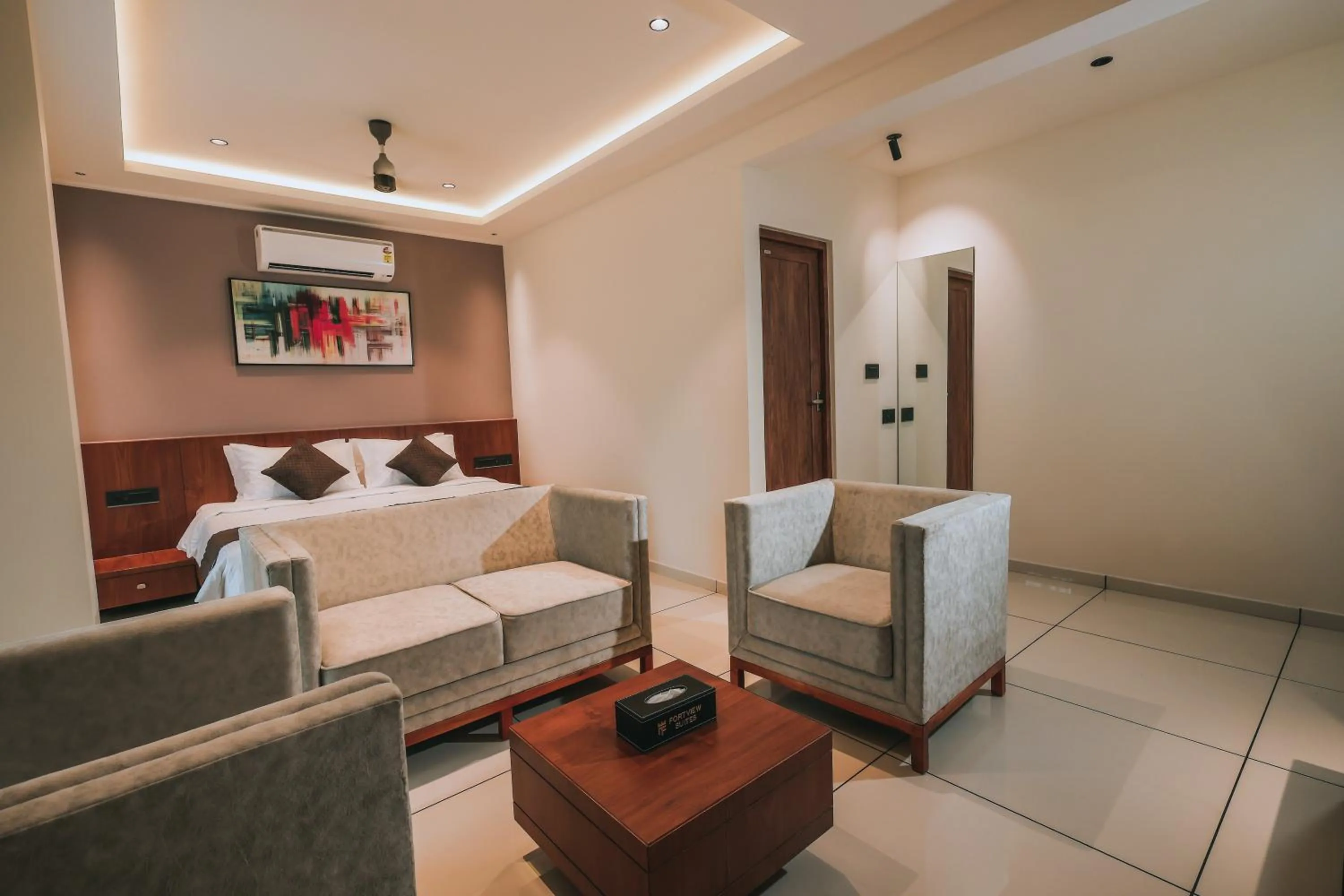 Seating area, Bed in Fortview Suites