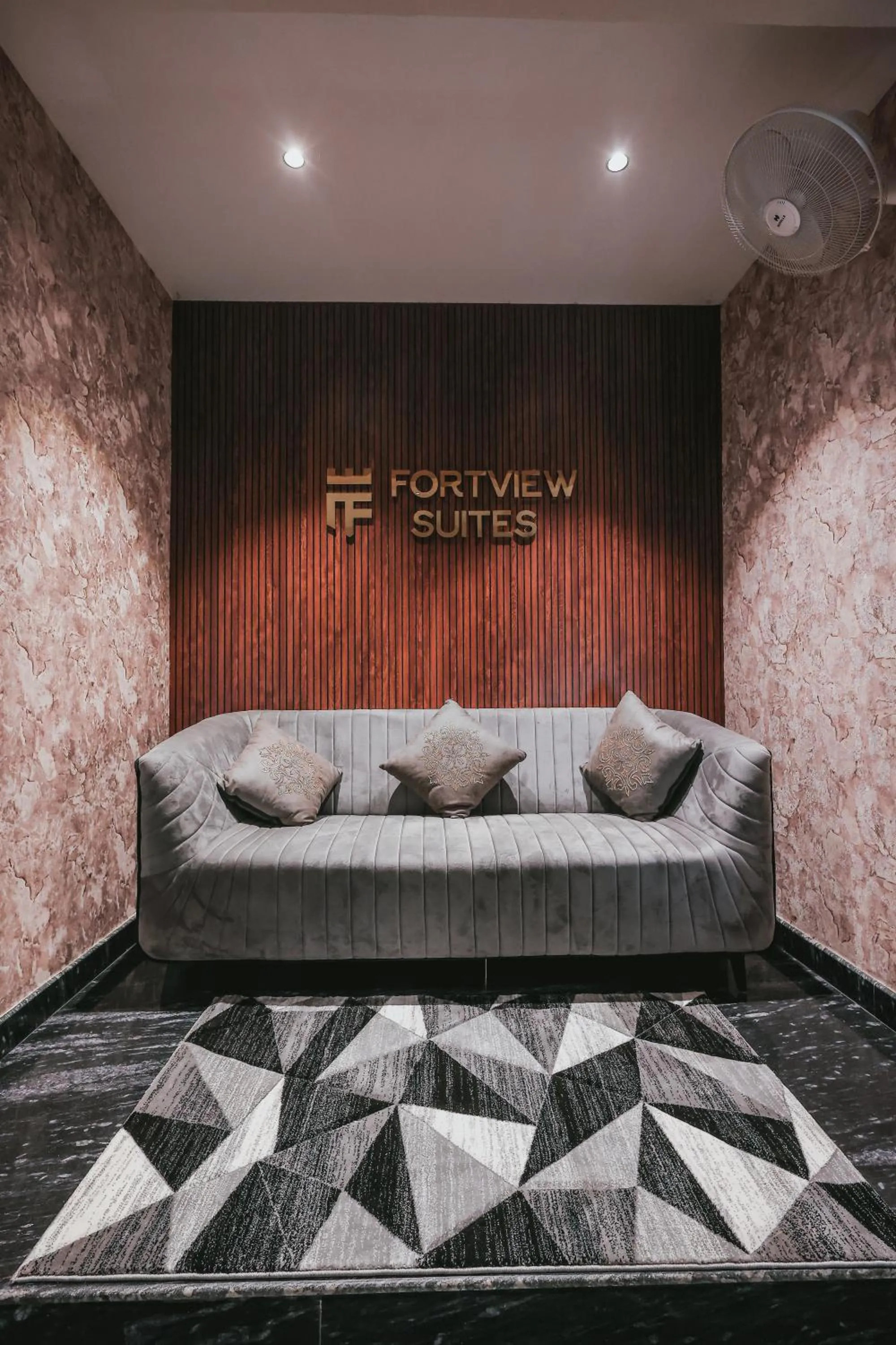 Seating area, Bed in Fortview Suites