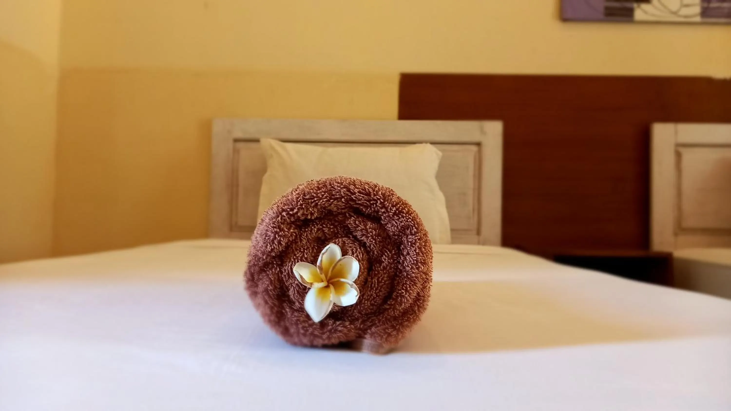 towels, Bed in Wisma Bunda