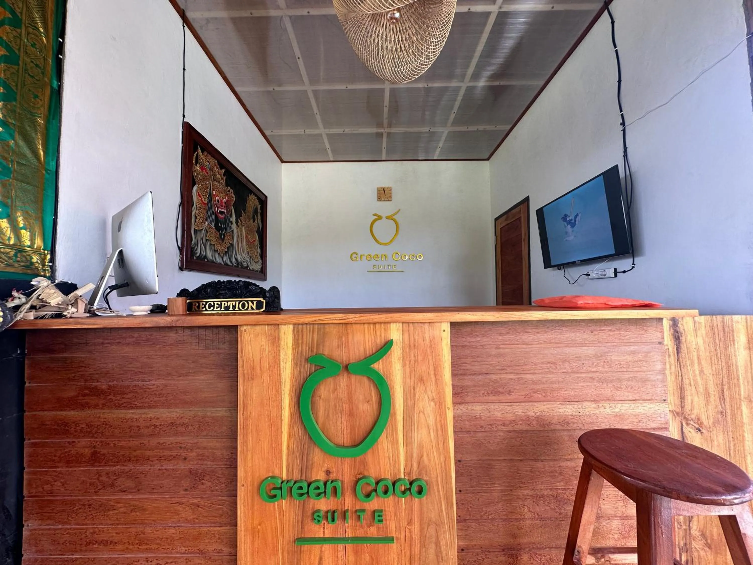 Property logo or sign in Green Coco Suite