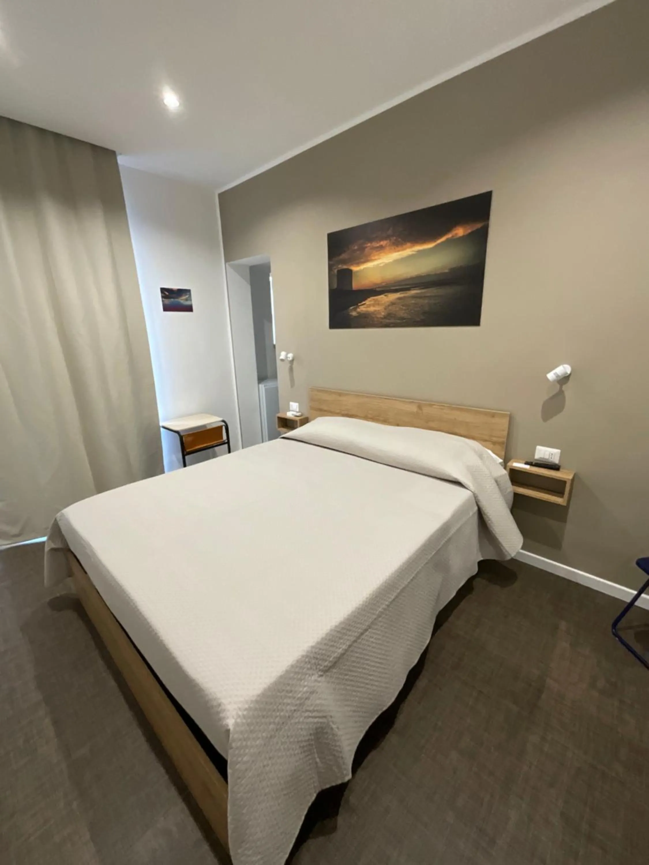 Bed in M&M rooms Margherita di Savoia