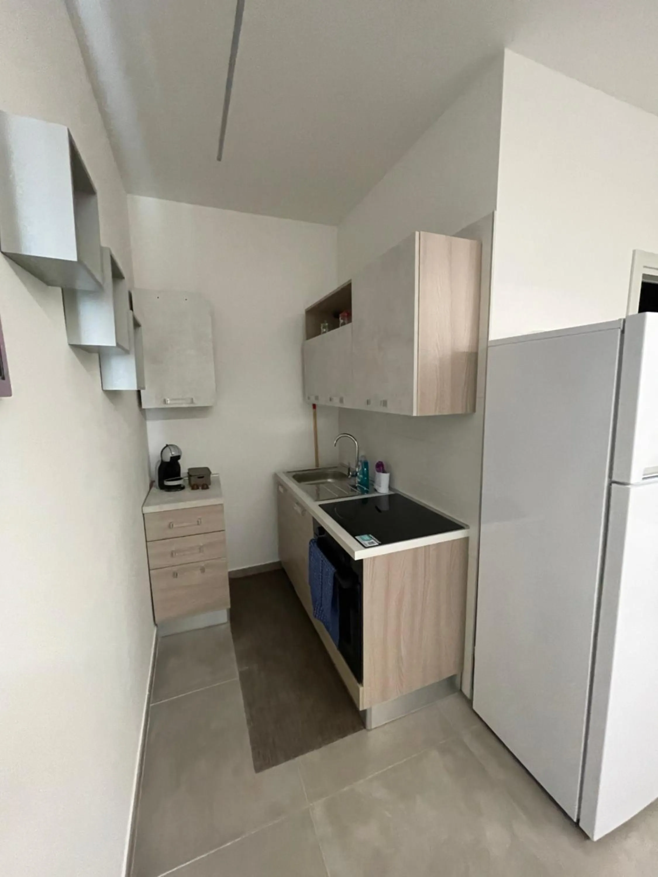 Kitchen/Kitchenette in M&M rooms Margherita di Savoia