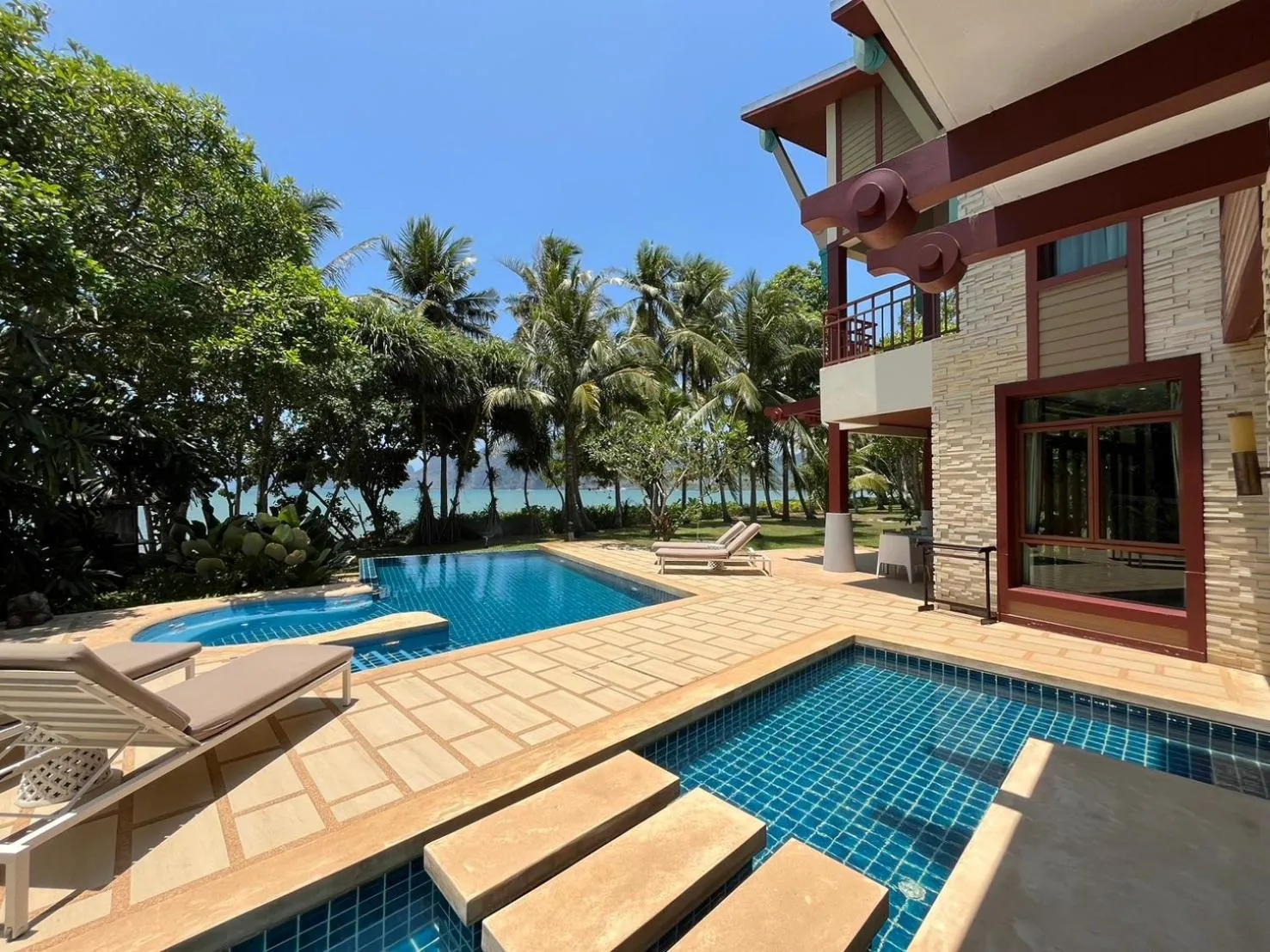 Swimming pool in Amatapura Beachfront Villa 1, SHA Certified