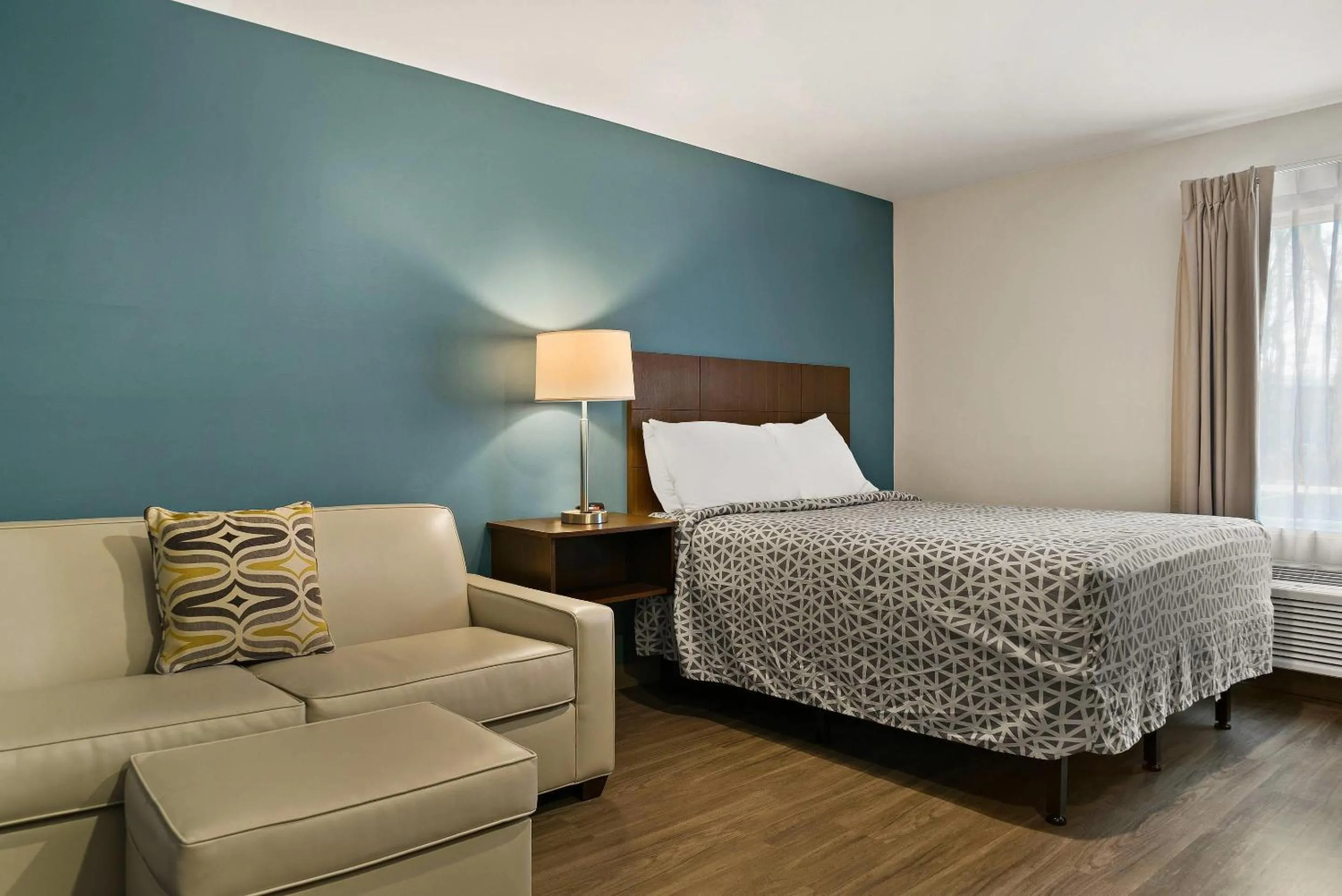 Bedroom, Bed in WoodSpring Suites East Lansing - University Area