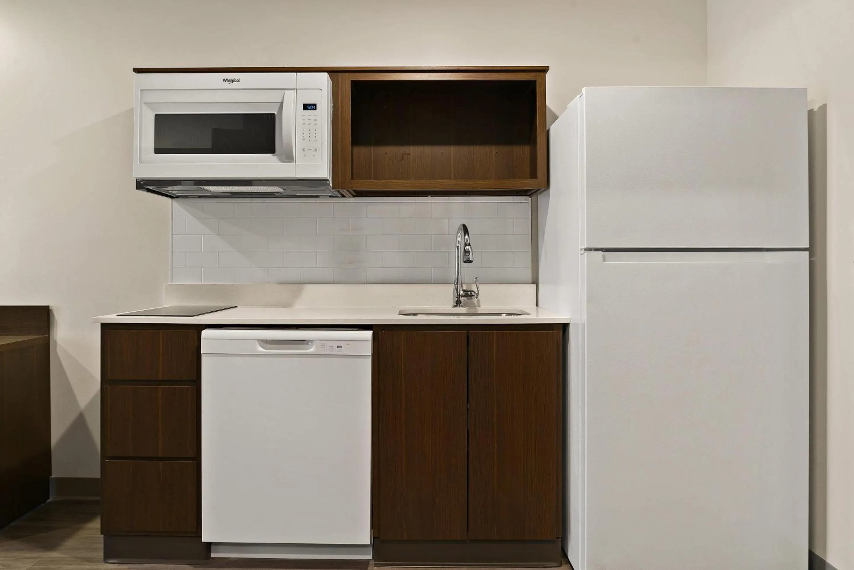 Bedroom in WoodSpring Suites East Lansing - University Area