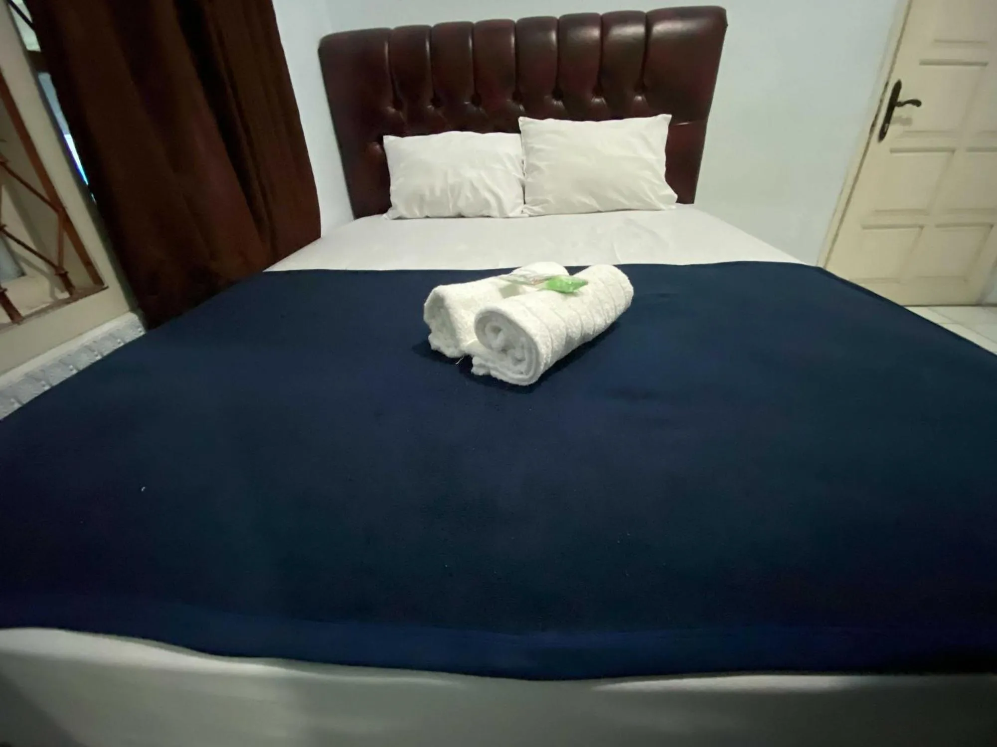 Bed in Guest House Hj Muriyah Syariah Slawi Mitra RedDoorz