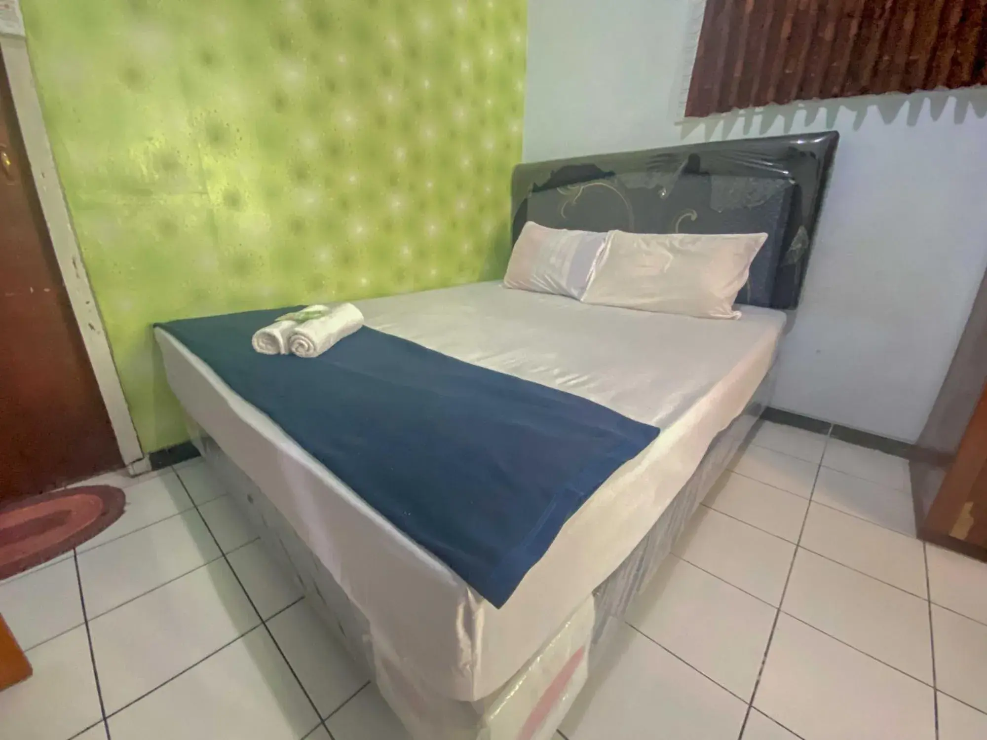 Bed in Guest House Hj Muriyah Syariah Slawi Mitra RedDoorz Bed in Guest House Hj Muriyah Syariah Slawi Mitra RedDoorz