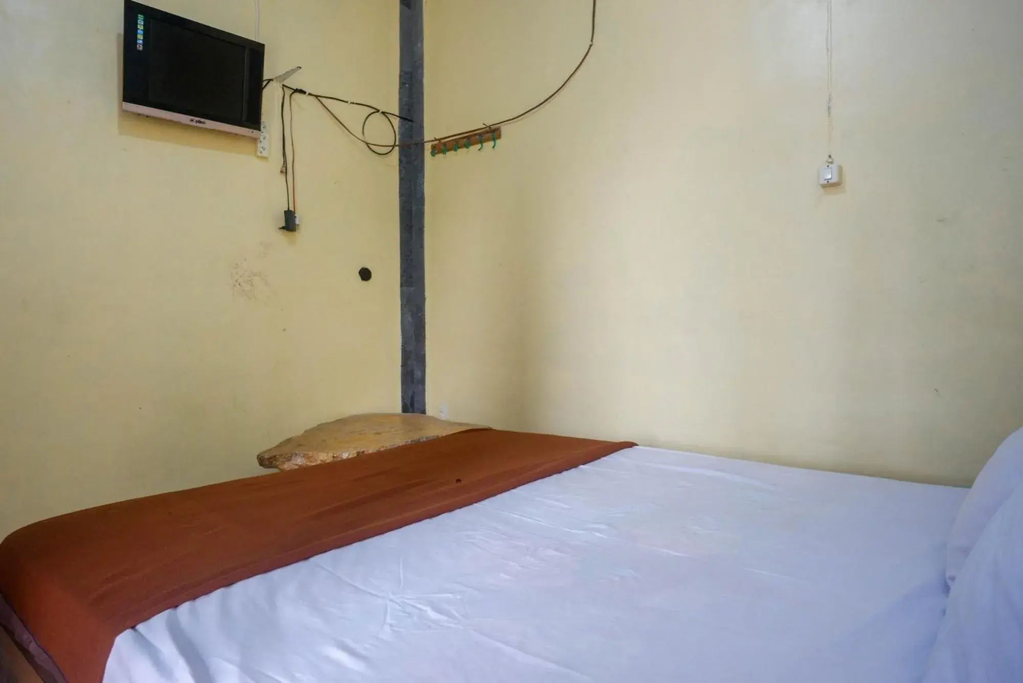 Bed in Hotel Kampoeng Drini RedPartner Bed in Hotel Kampoeng Drini RedPartner