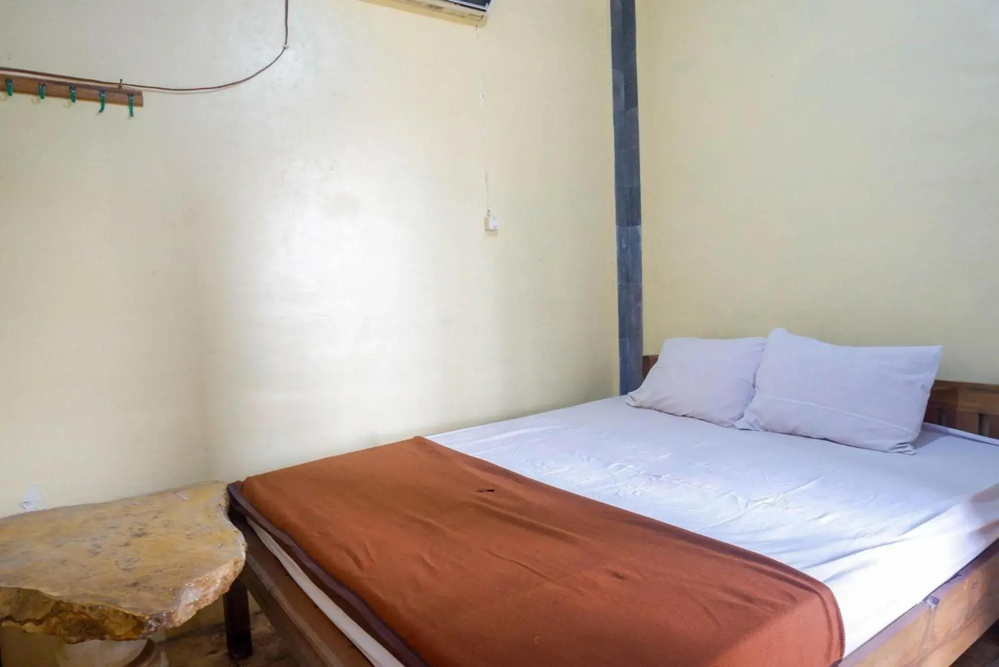 Bed in Hotel Kampoeng Drini RedPartner Bed in Hotel Kampoeng Drini RedPartner