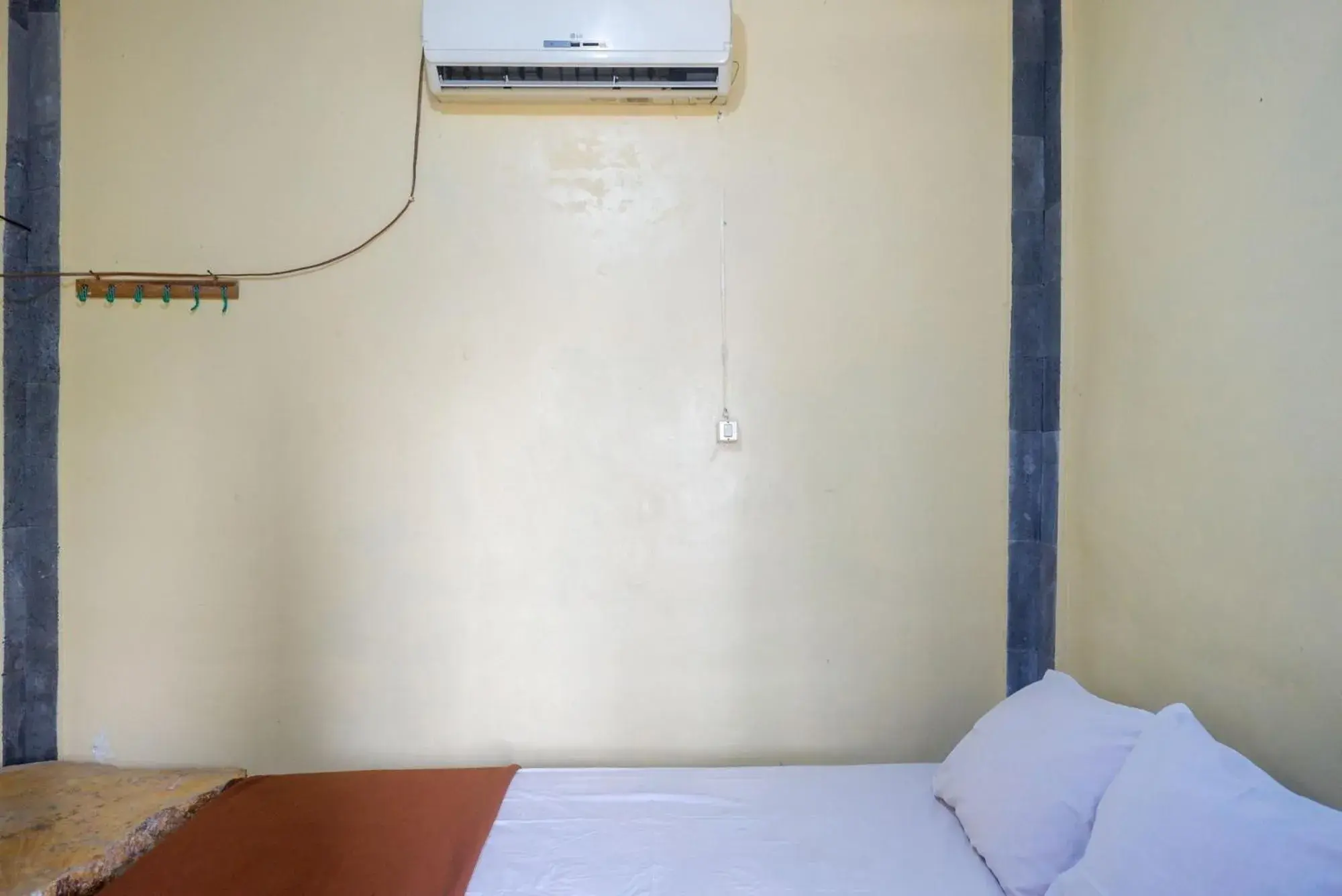 Bed in Hotel Kampoeng Drini RedPartner Bed in Hotel Kampoeng Drini RedPartner