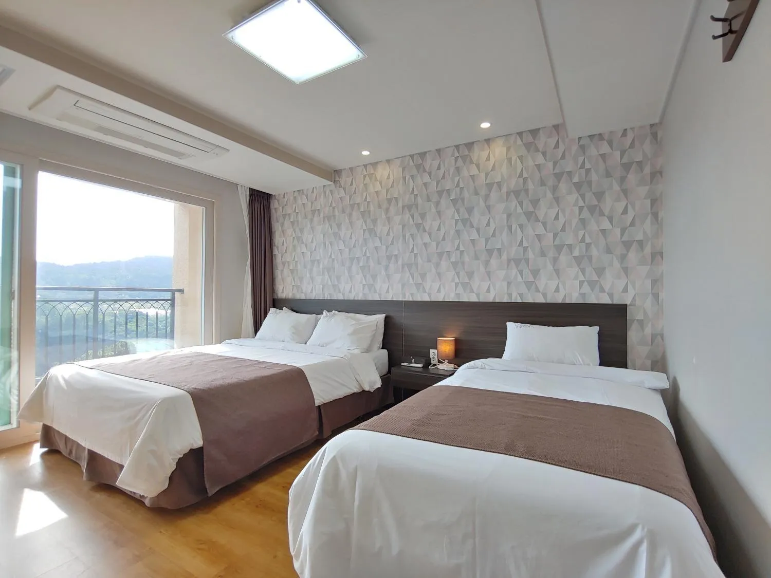 Bed in Jeju Lavender Hotel