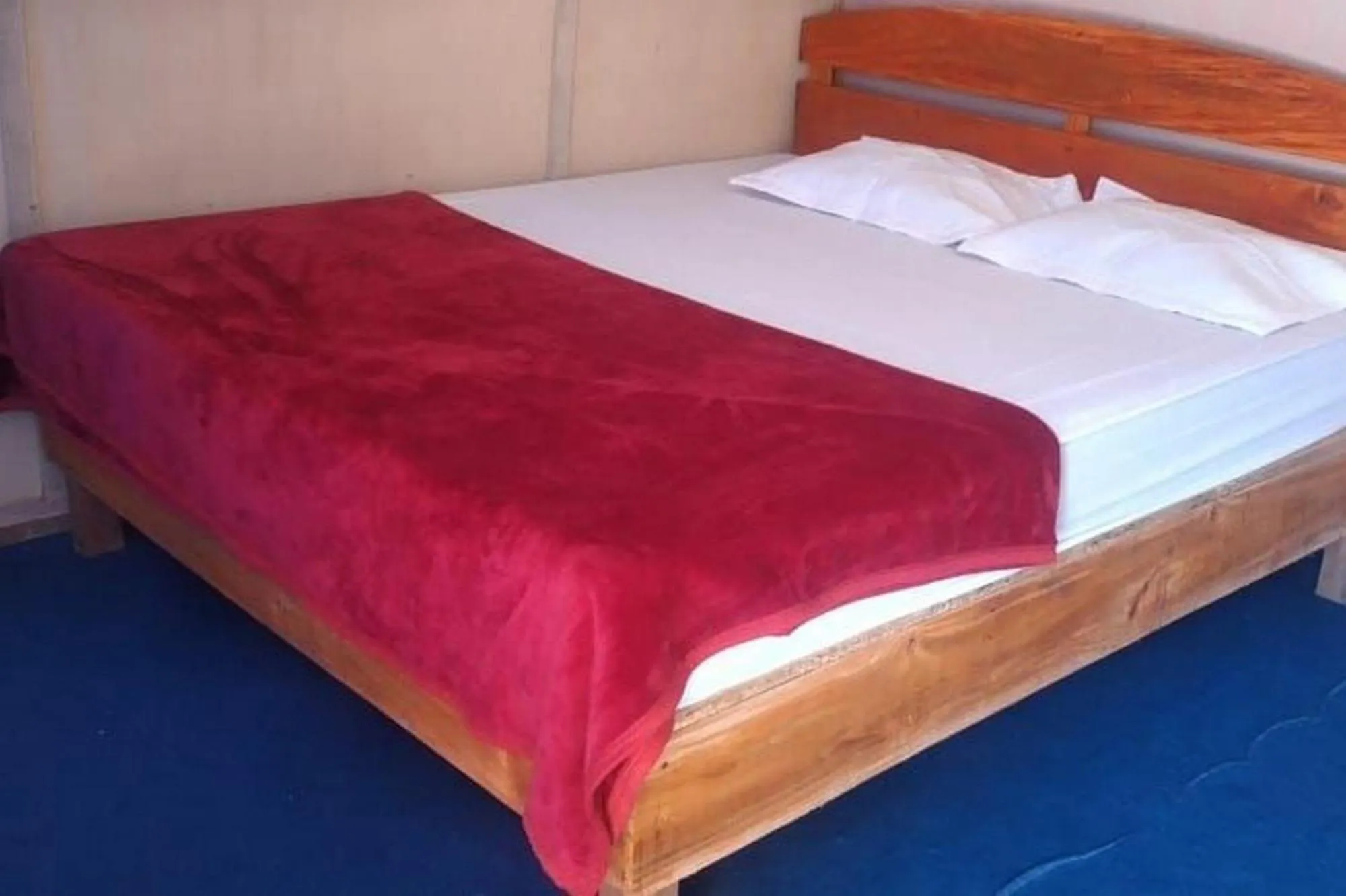 Bed in Penginapan puncak Dua Mitra RedDoorz