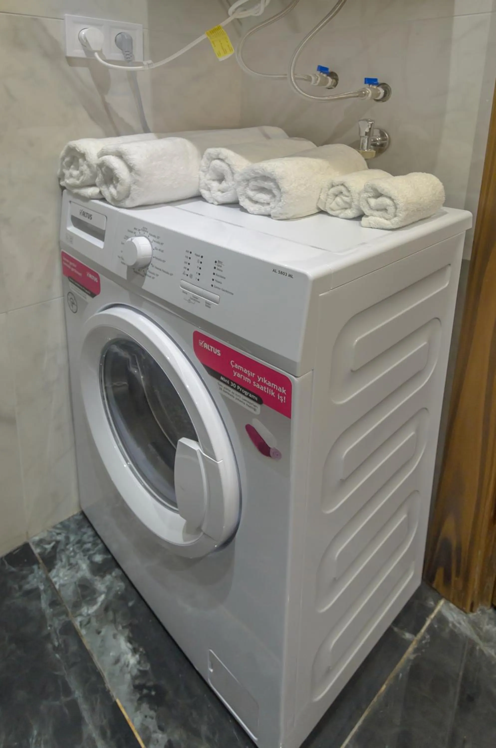 washing machine in Beachfront Batumi View Apartments by GLOBALSTAY