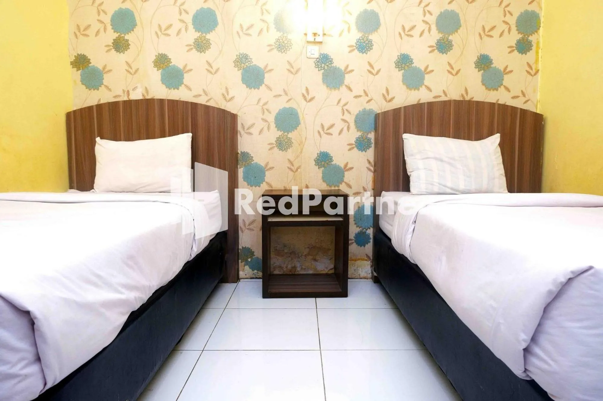 Bed in Hotel Permata Makassar Mitra RedDoorz